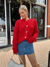 Red chunky knit cardigan with tortoise shell buttons. 