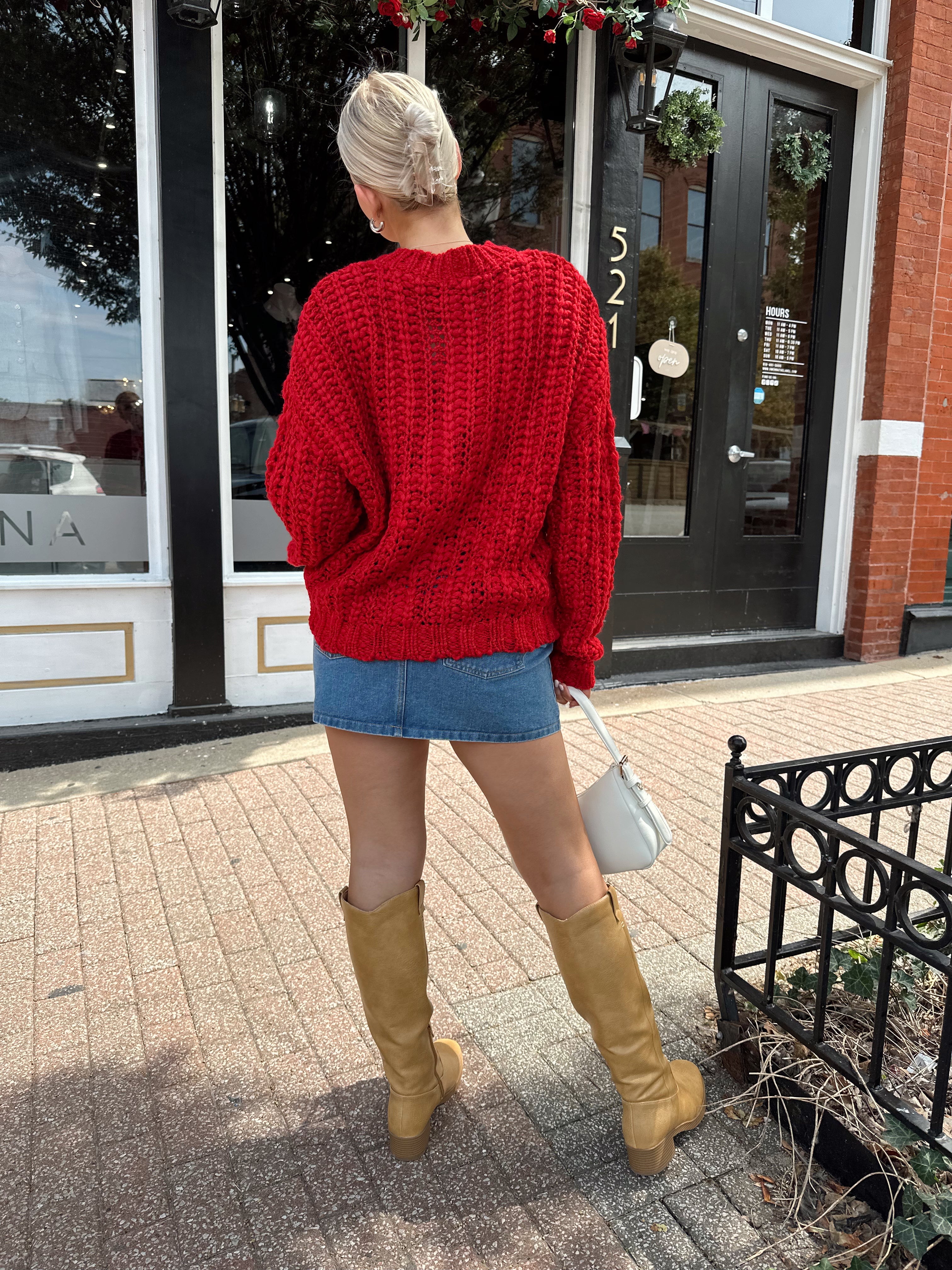 Red chunky knit cardigan with tortoise shell buttons. 
