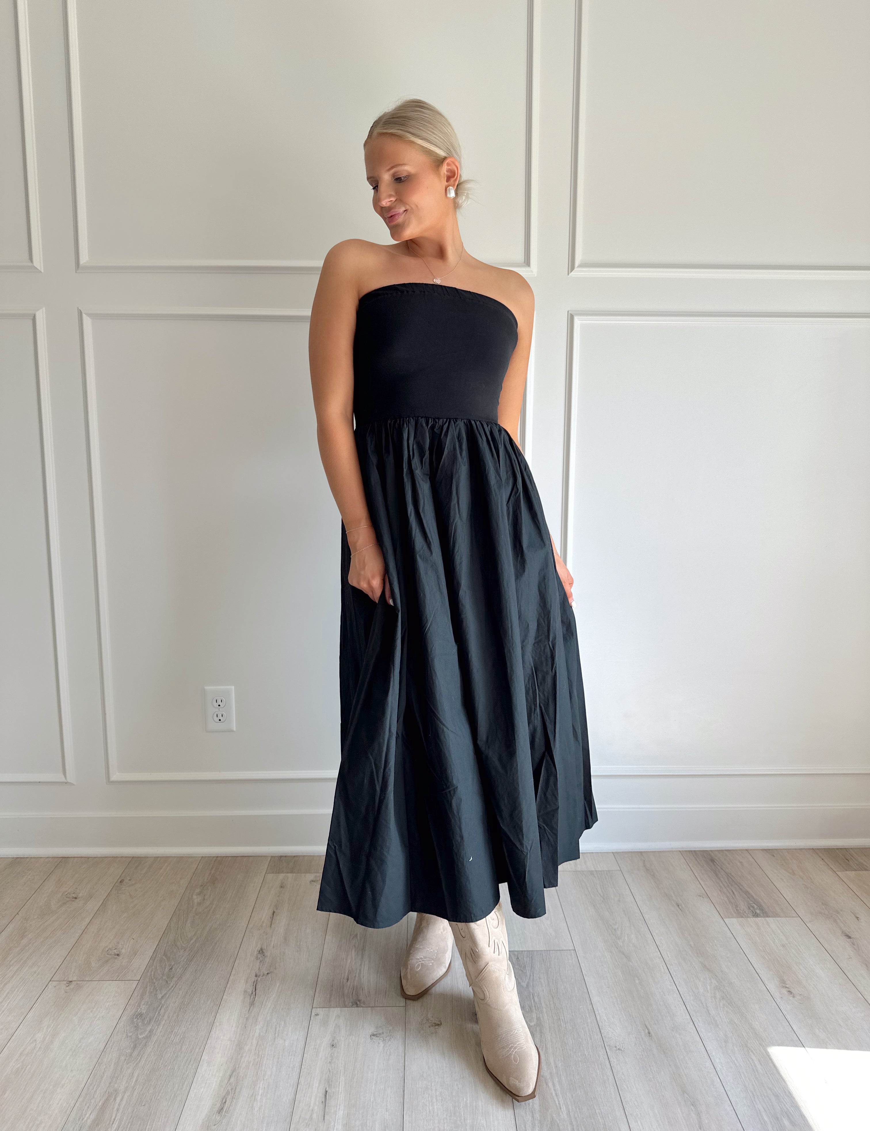 Casual black strapless midi dress with functional pockets.