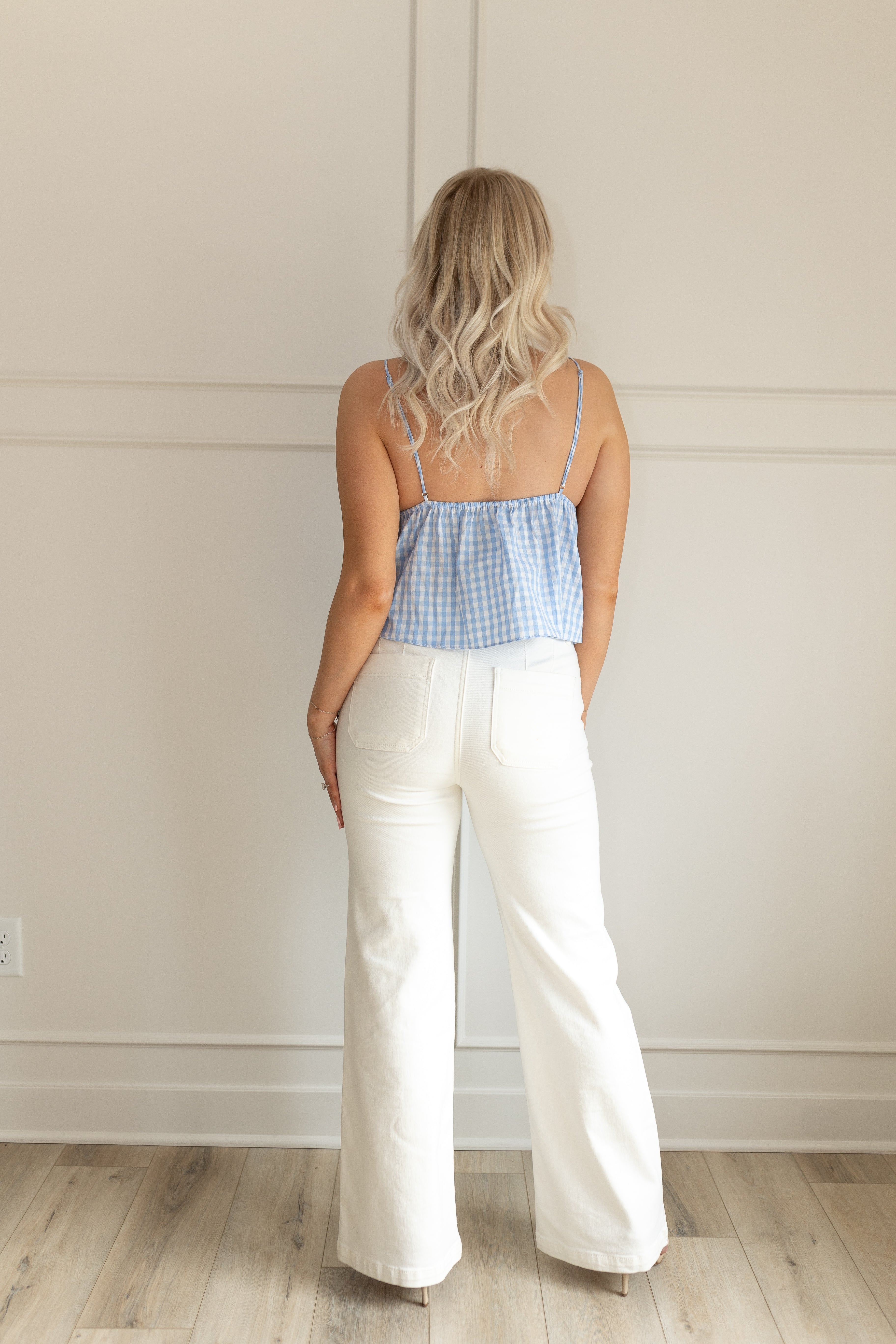 Blue and white gingham pattern cami tank top with lace trim. Adjustable spaghetti straps.