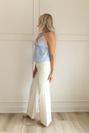 Blue and white gingham pattern cami tank top with lace trim. Adjustable spaghetti straps.