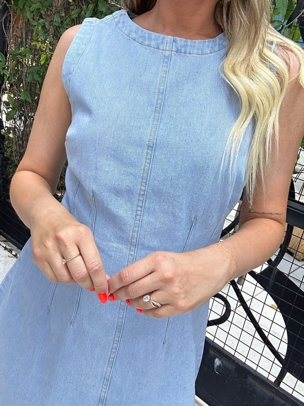 Della sleeveless light wash denim mini dress with seams