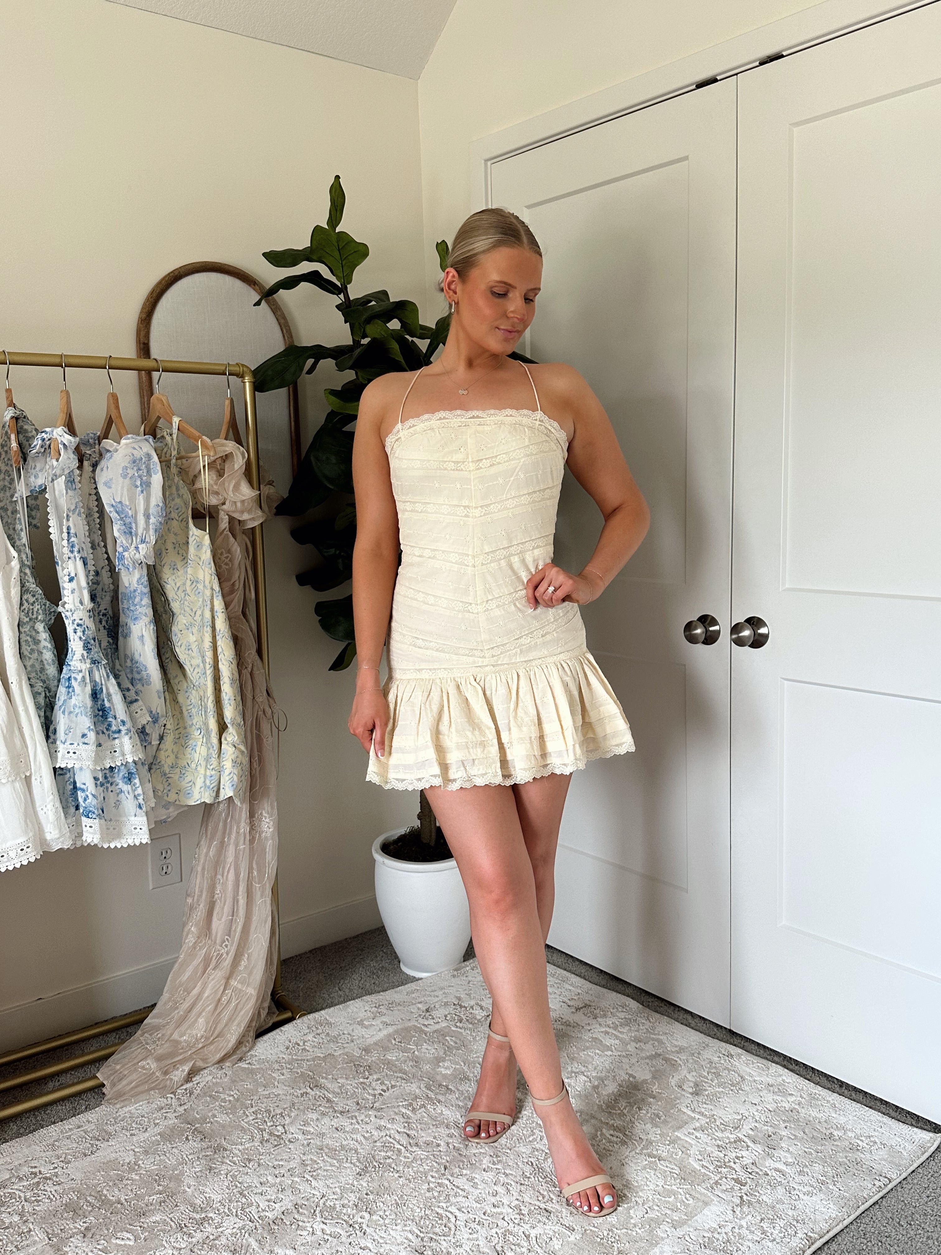 Light yellow lace detail mini dress with straight neckline, adjustable straps.