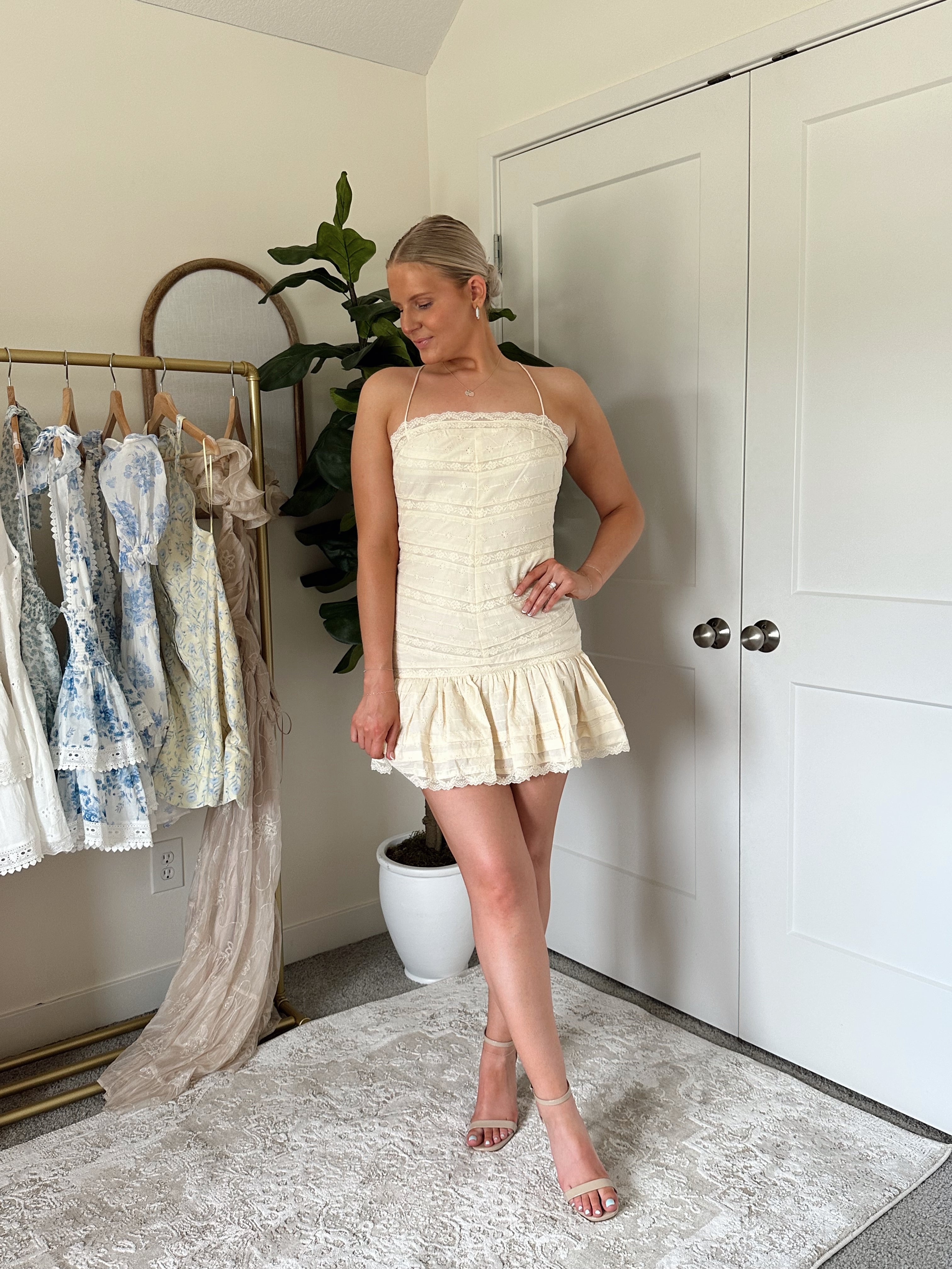 Light yellow lace detail mini dress with straight neckline, adjustable straps.