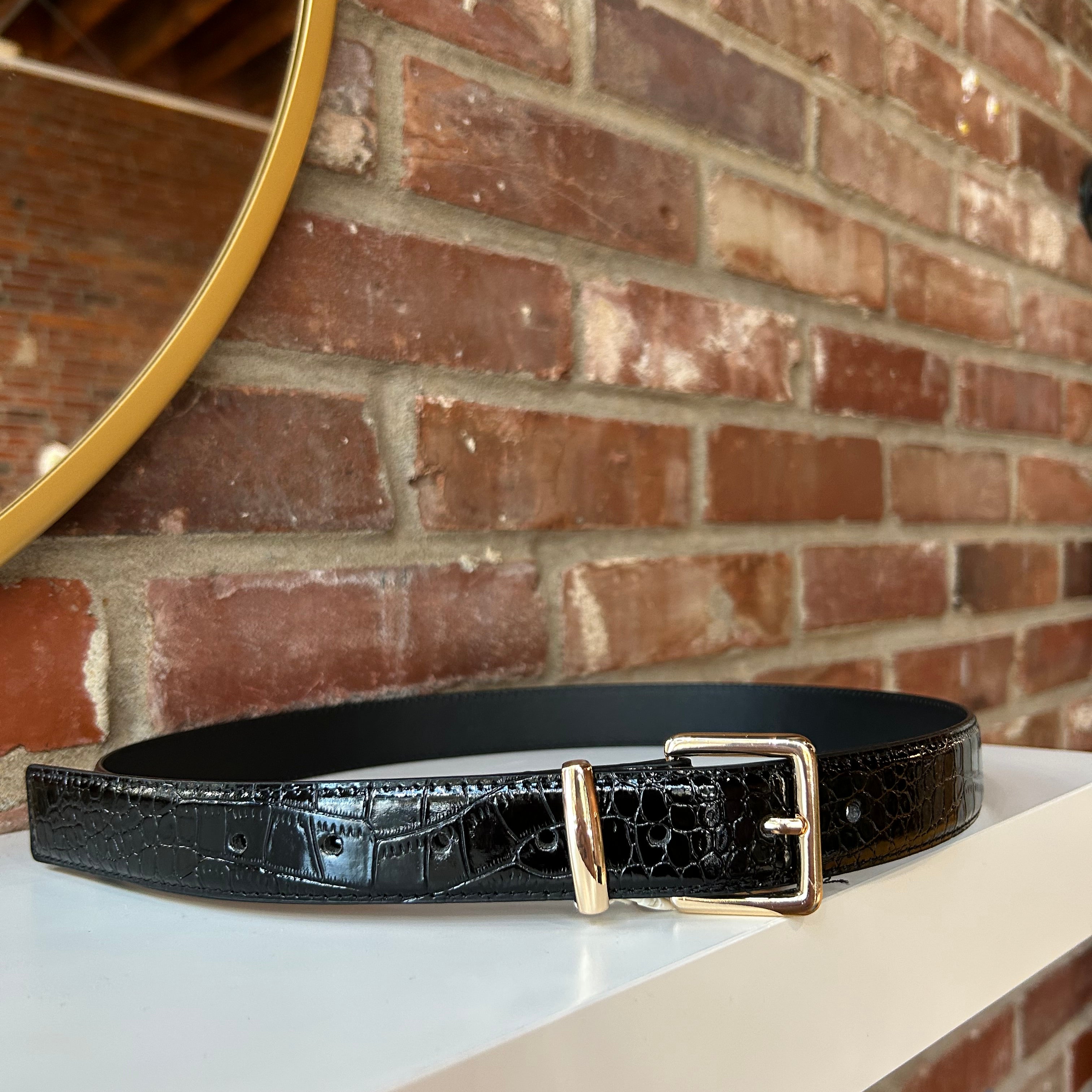 Black croc belt with gold buckle hardware.