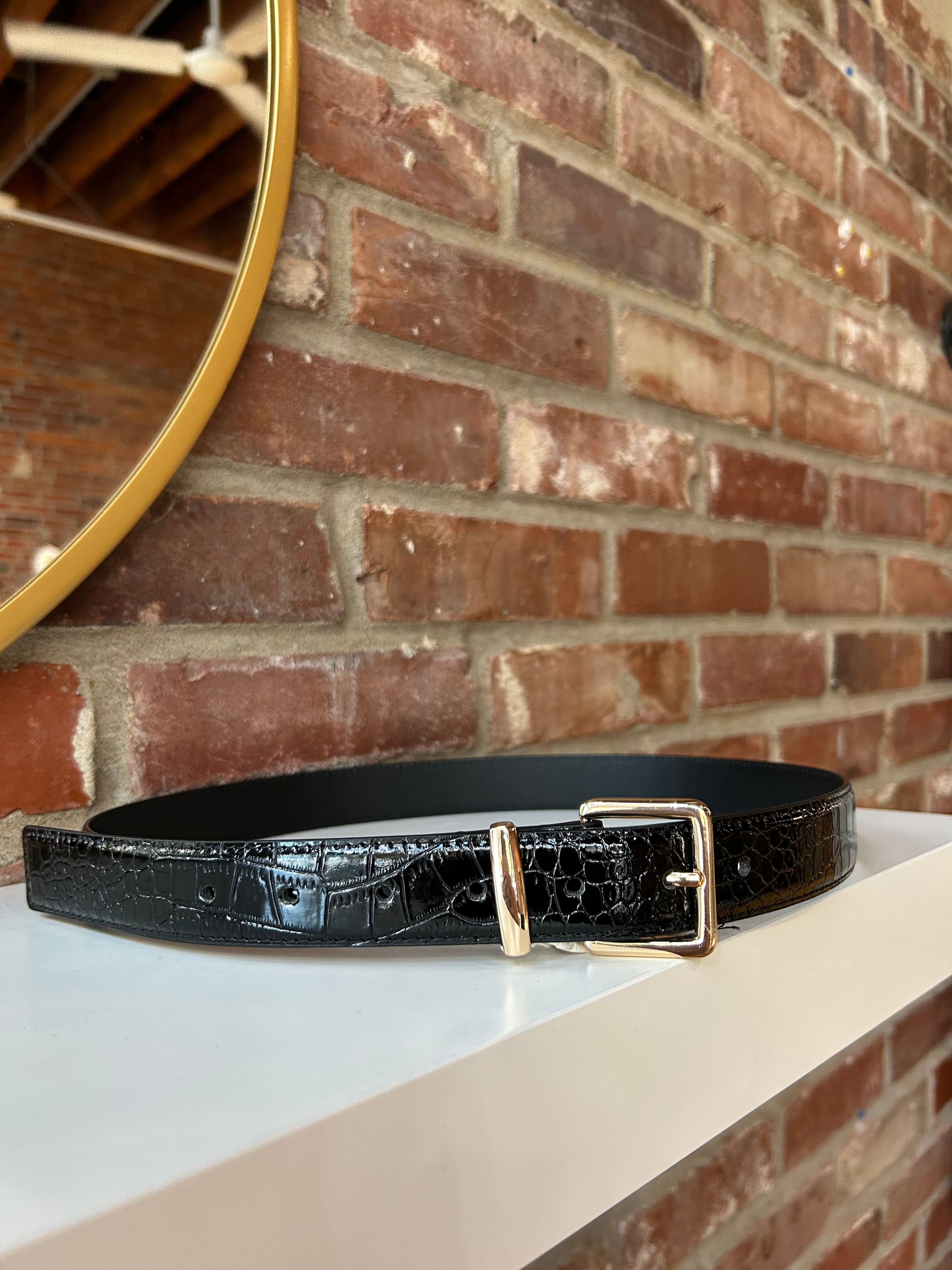 Black croc belt with gold buckle hardware.