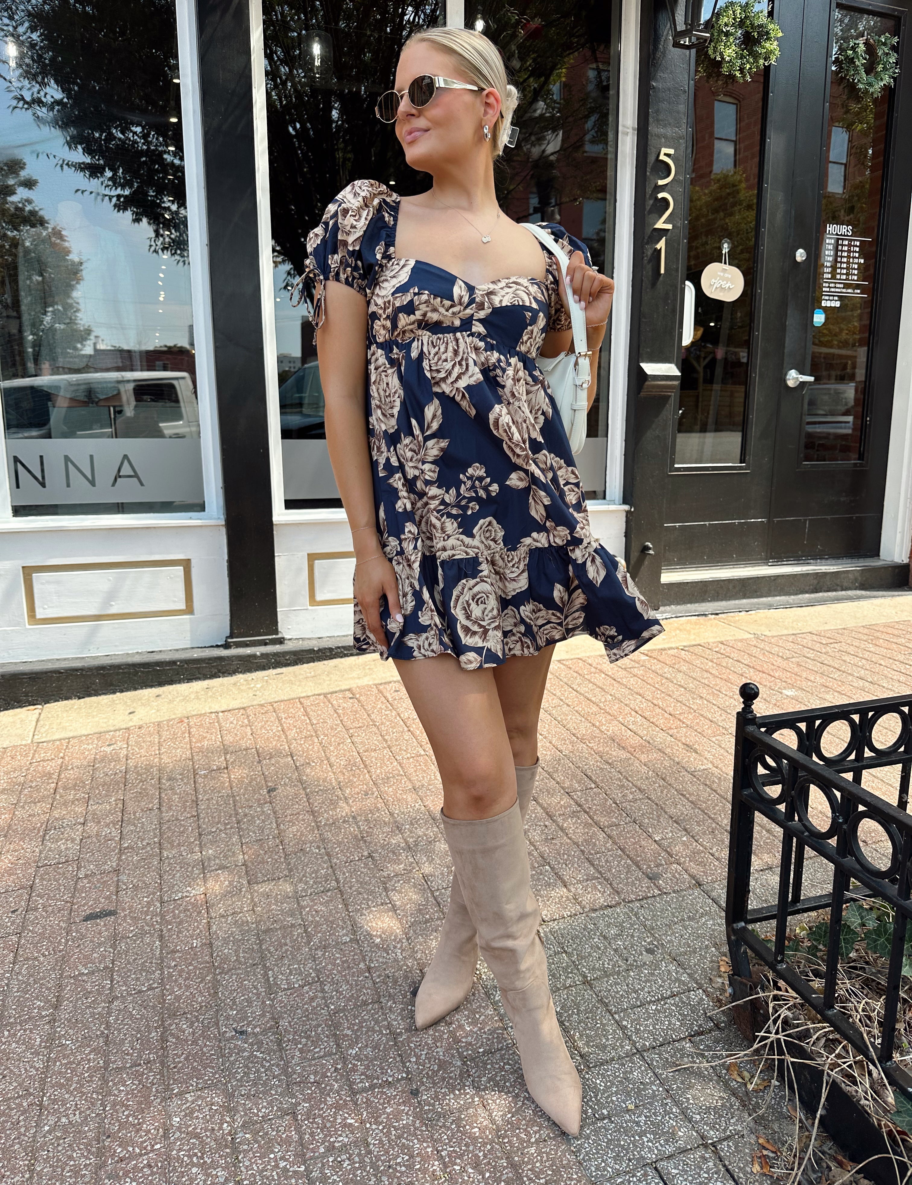 Navy blue floral baby doll mini dress with brown floral pattern. 