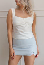 White lace-trim corset top with scoop back and ruched bust detail