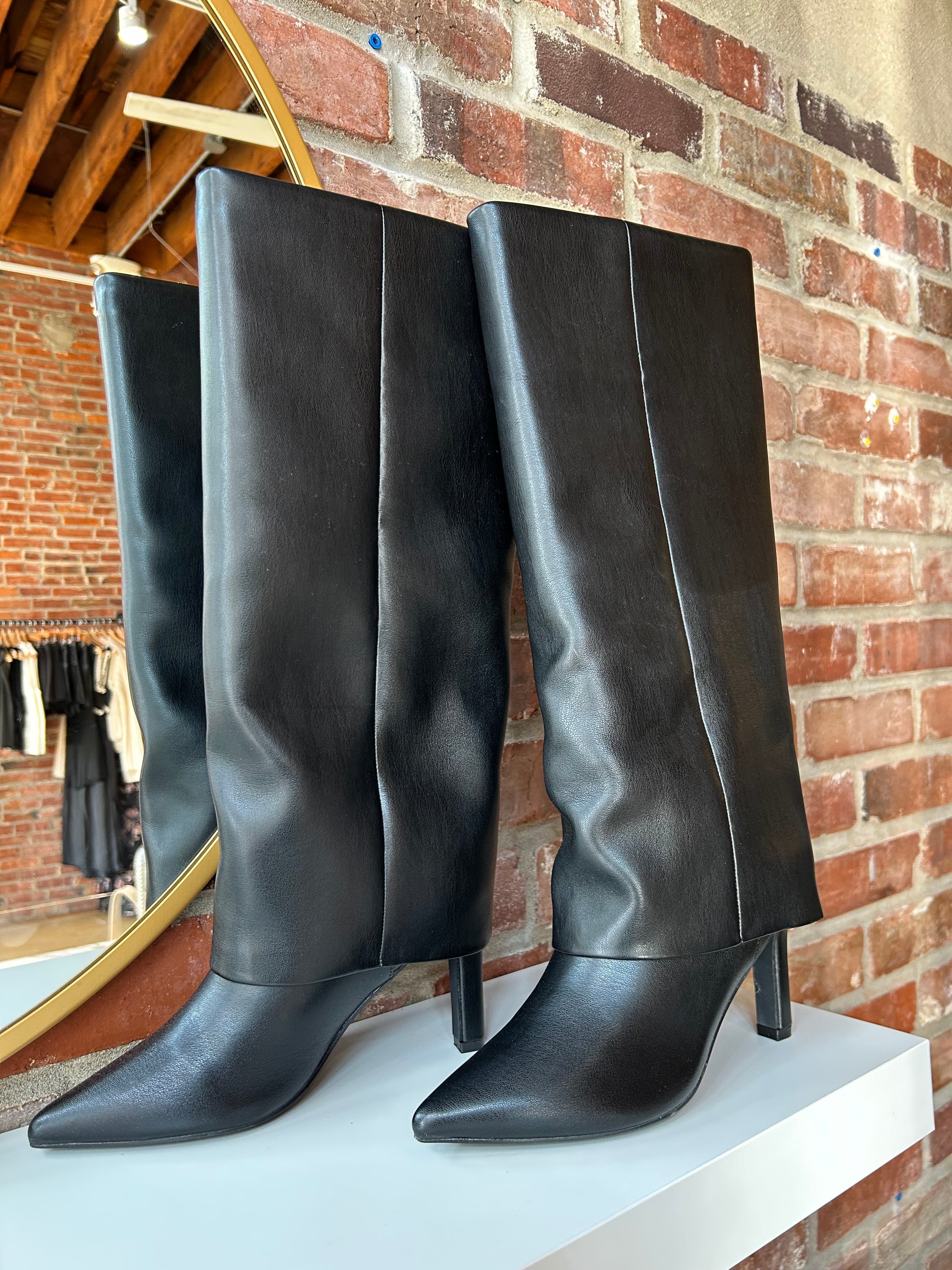 Black leather fold over knee boot with pointed toed and 3 1/4 inch heel.