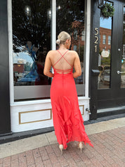 Coral maxi dress with ruffle detail and lace up back.
