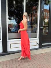 Coral maxi dress with ruffle detail and lace up back.