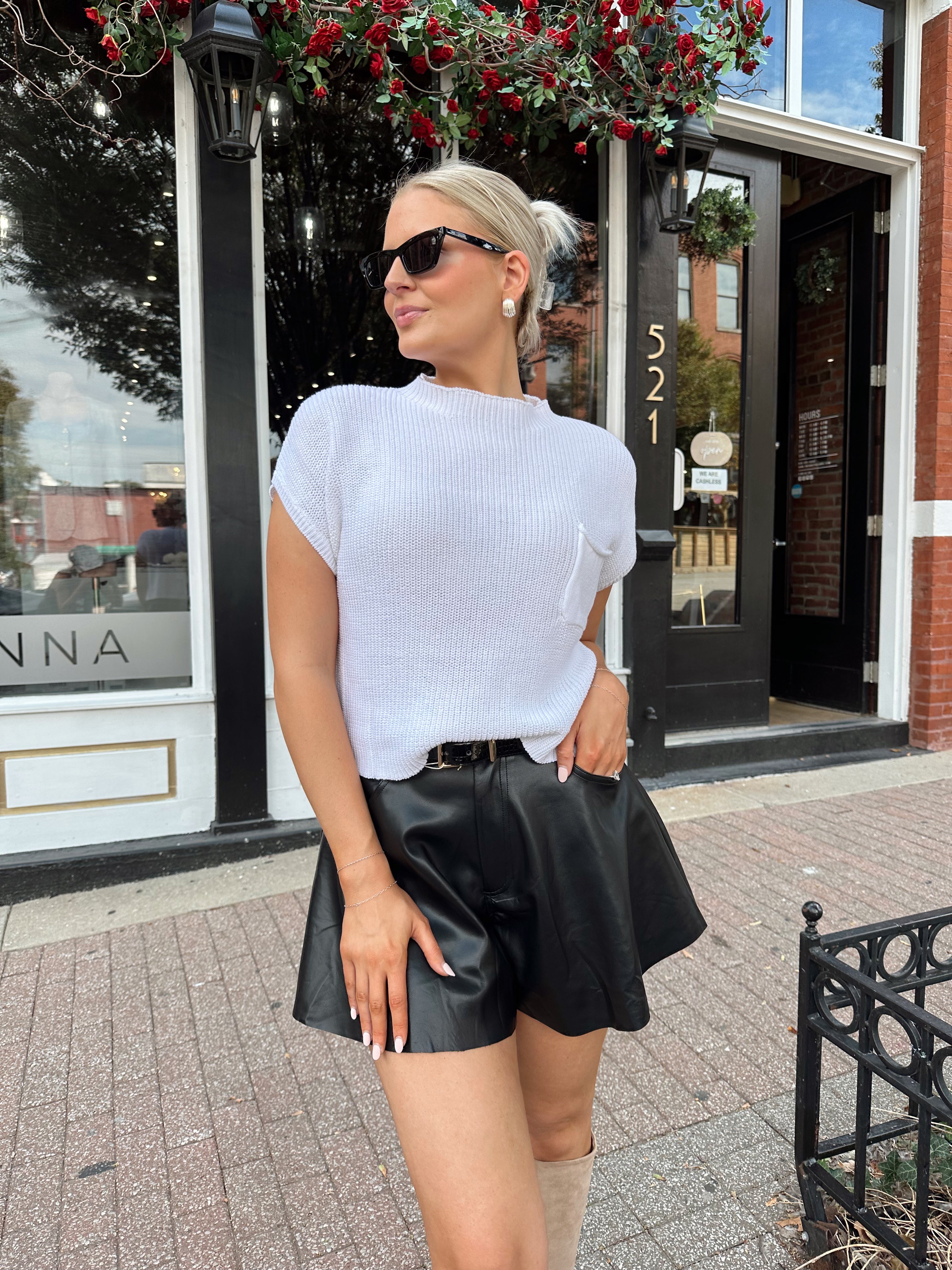 White knit cropped short sleeve sweater with front pocket detail