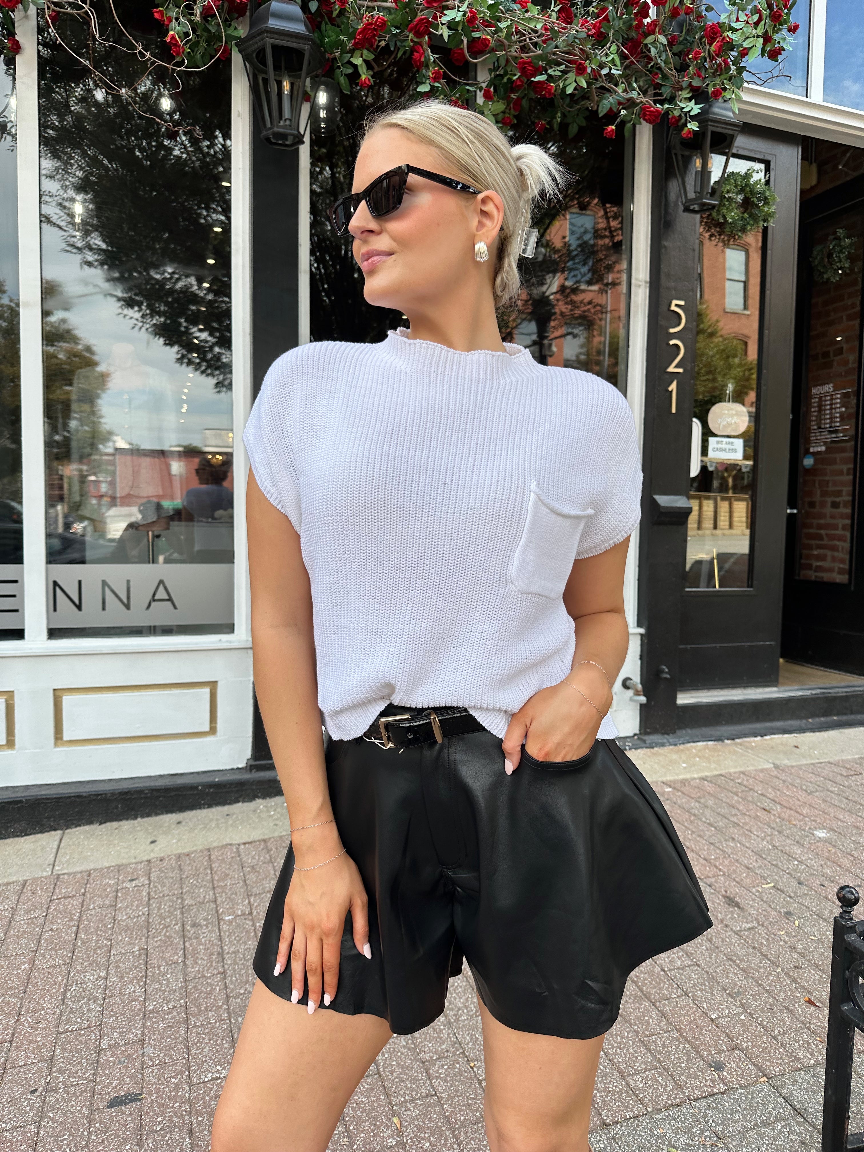 White knit cropped short sleeve sweater with front pocket detail