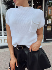 White knit cropped short sleeve sweater with front pocket detail