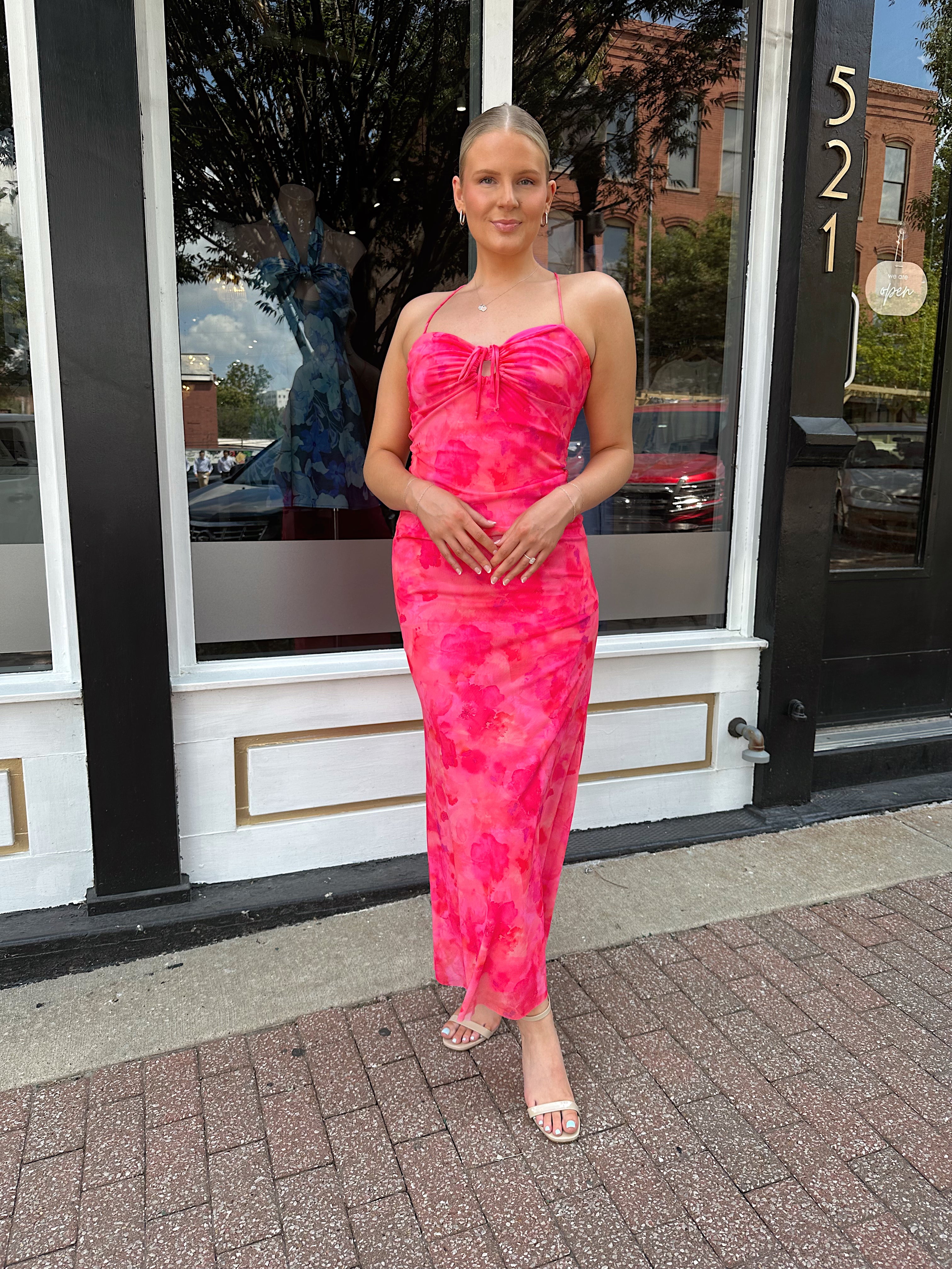 Hot pink floral mesh maxi dress with criss-cross back.