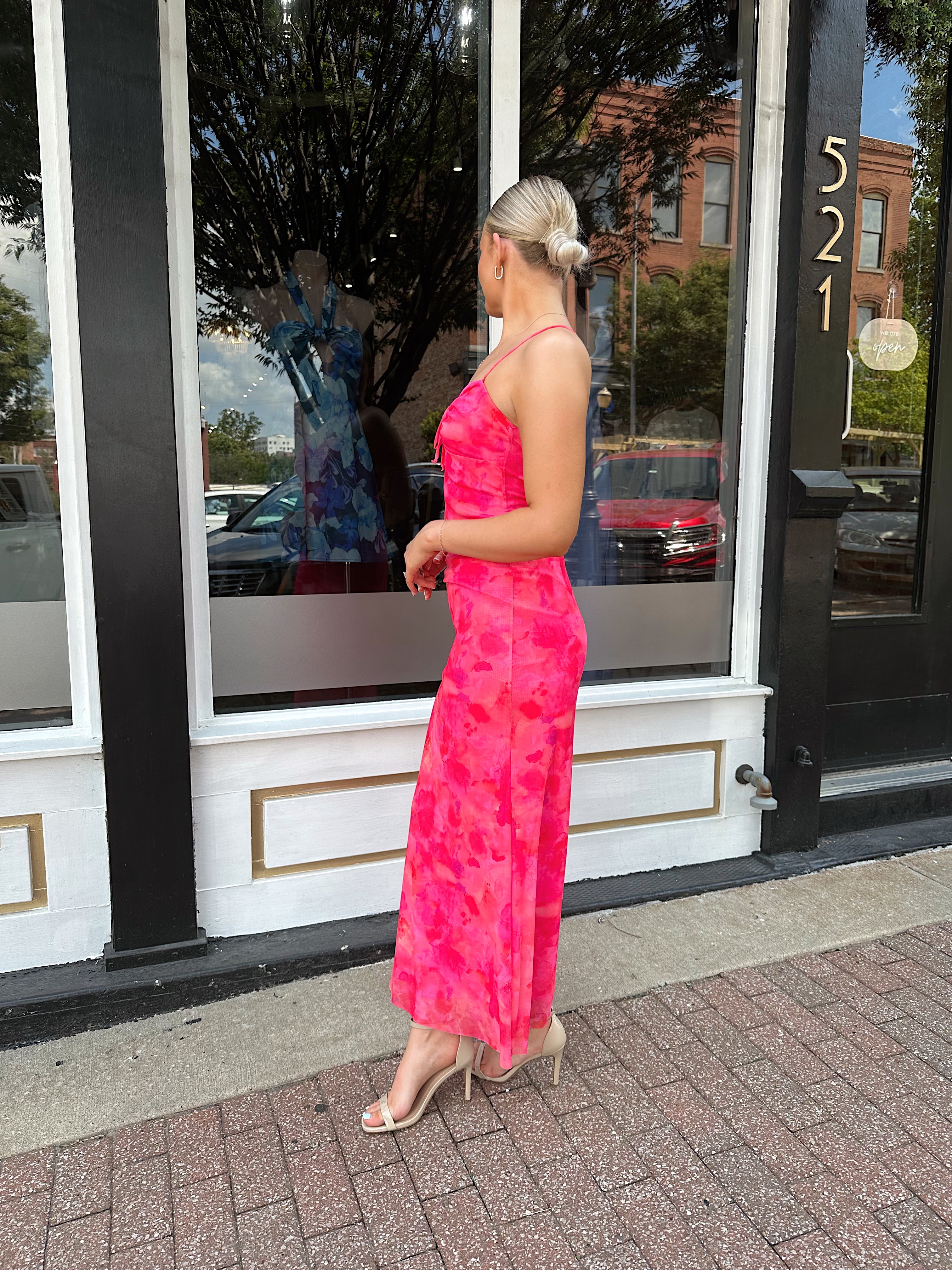 Hot pink floral mesh maxi dress with criss-cross back.