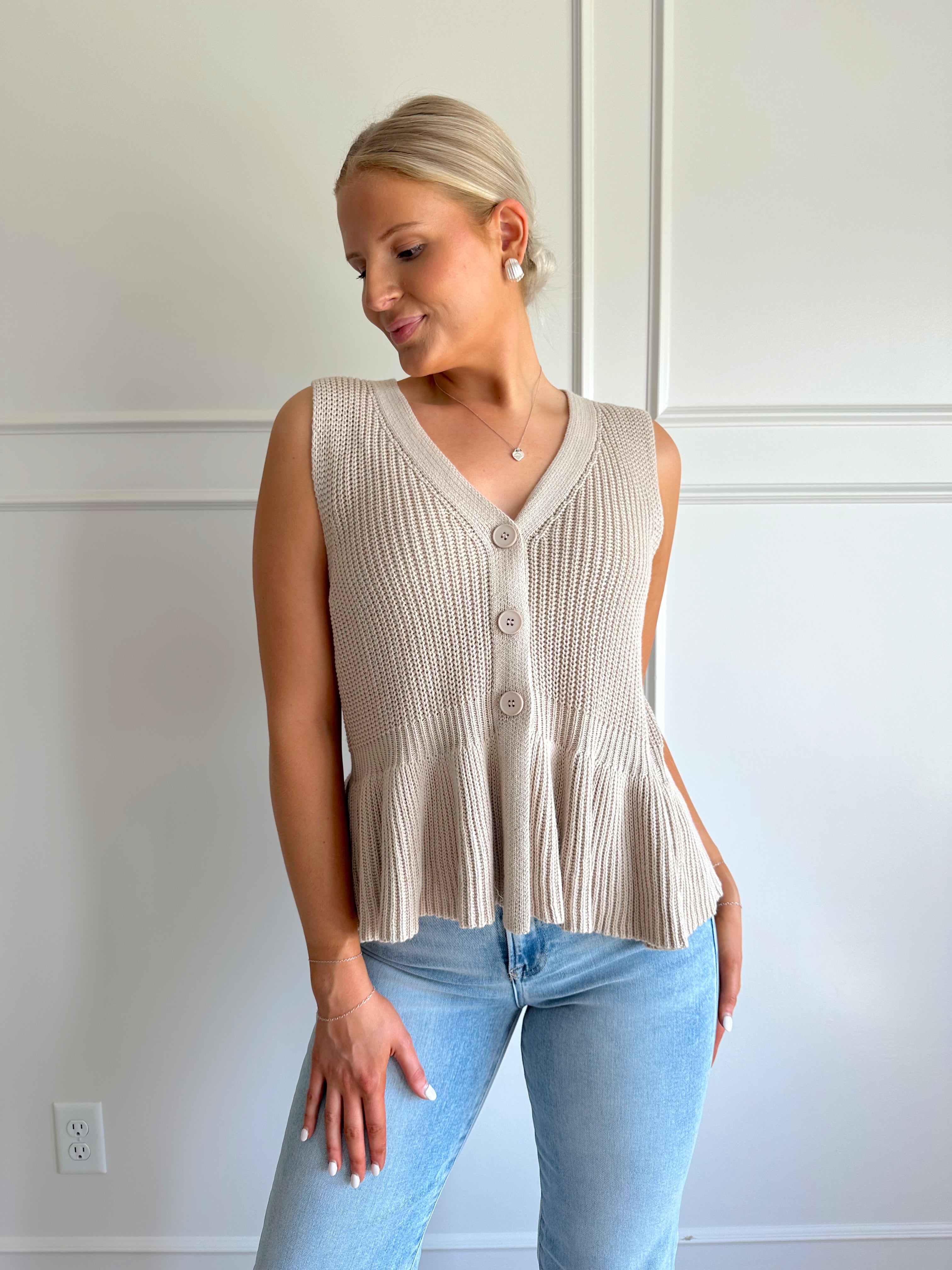 Taupe knit sweater vest top with button detailing.