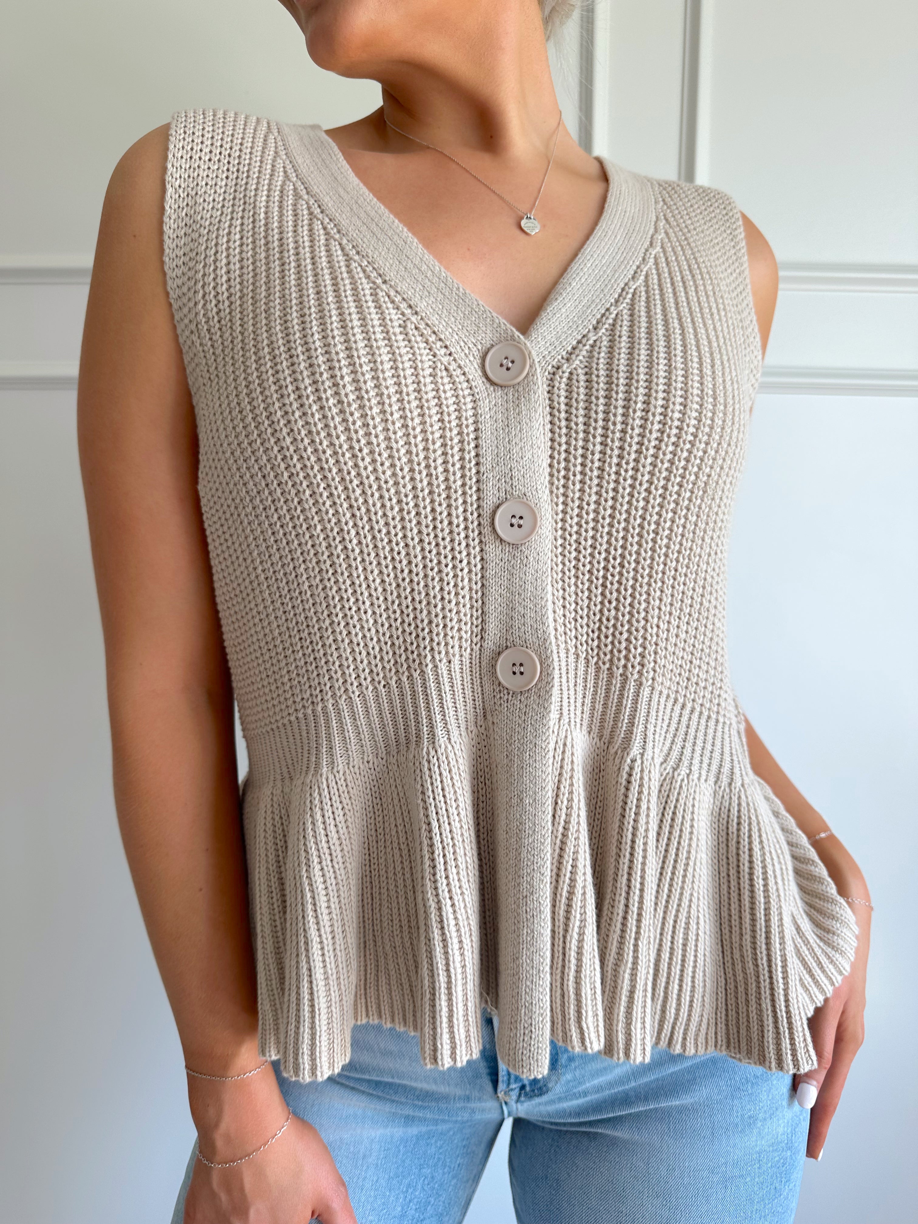 Taupe knit sweater vest top with button detailing.