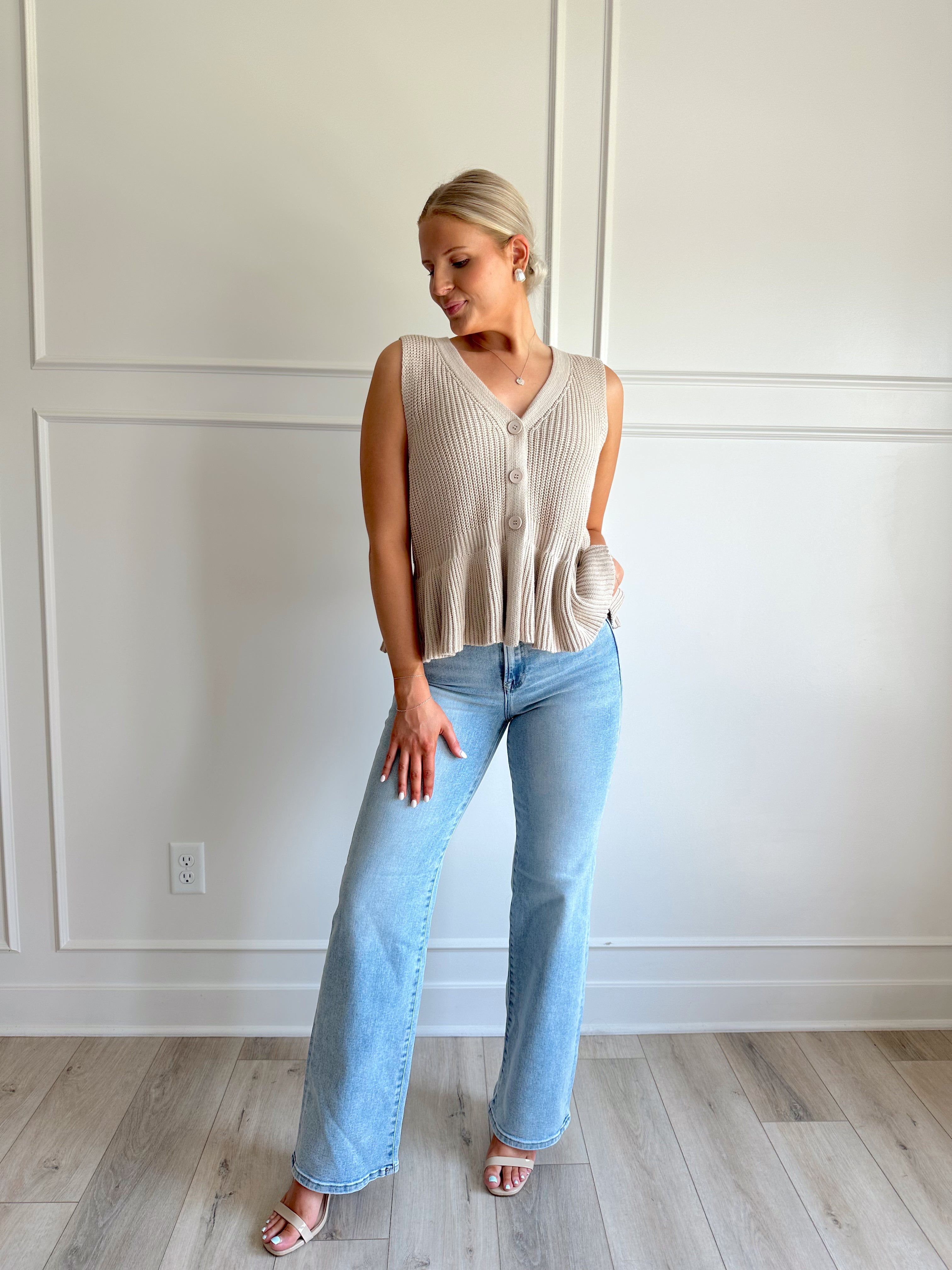 Taupe knit sweater vest top with button detailing.