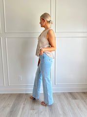 Taupe knit sweater vest top with button detailing.