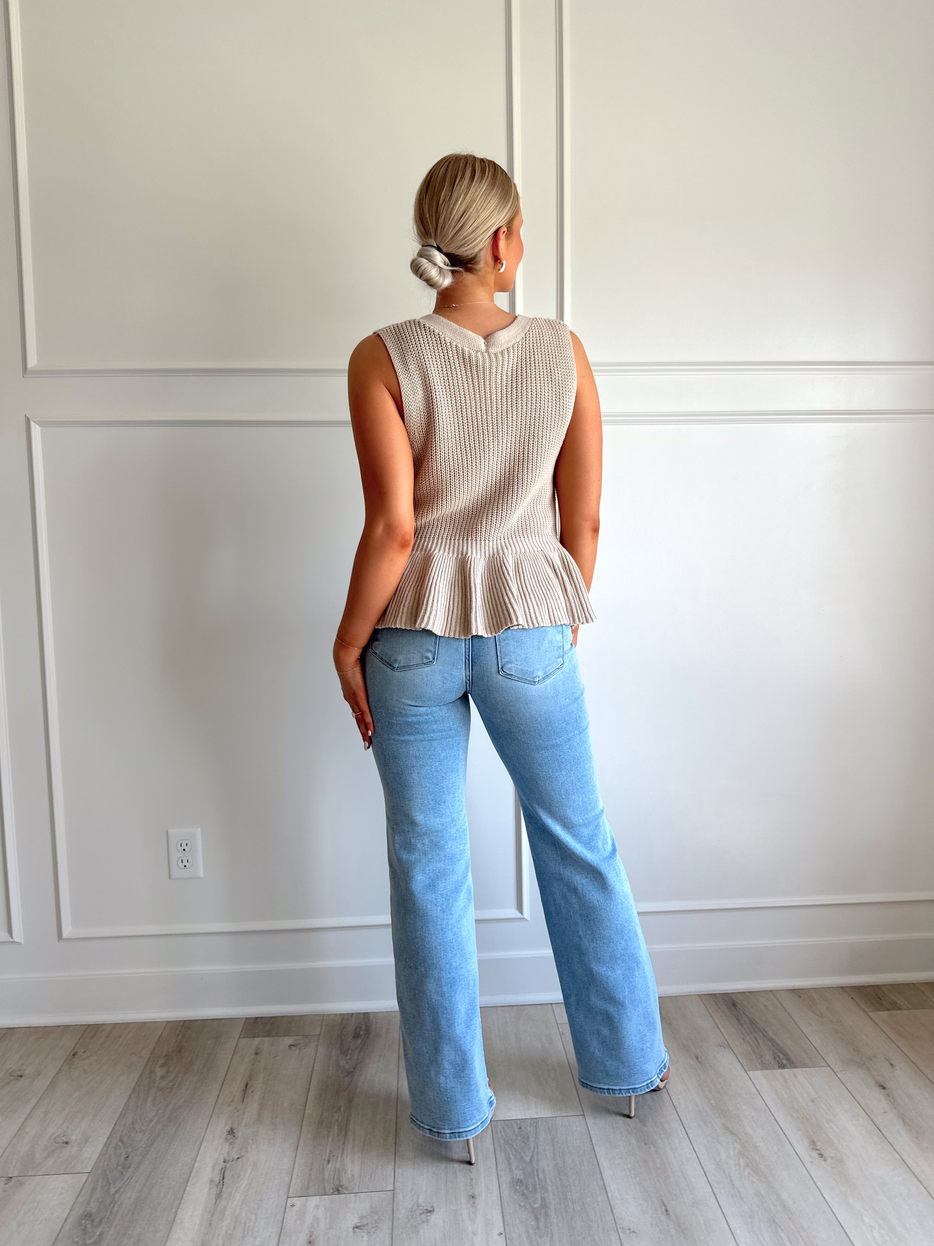 Taupe knit sweater vest top with button detailing.
