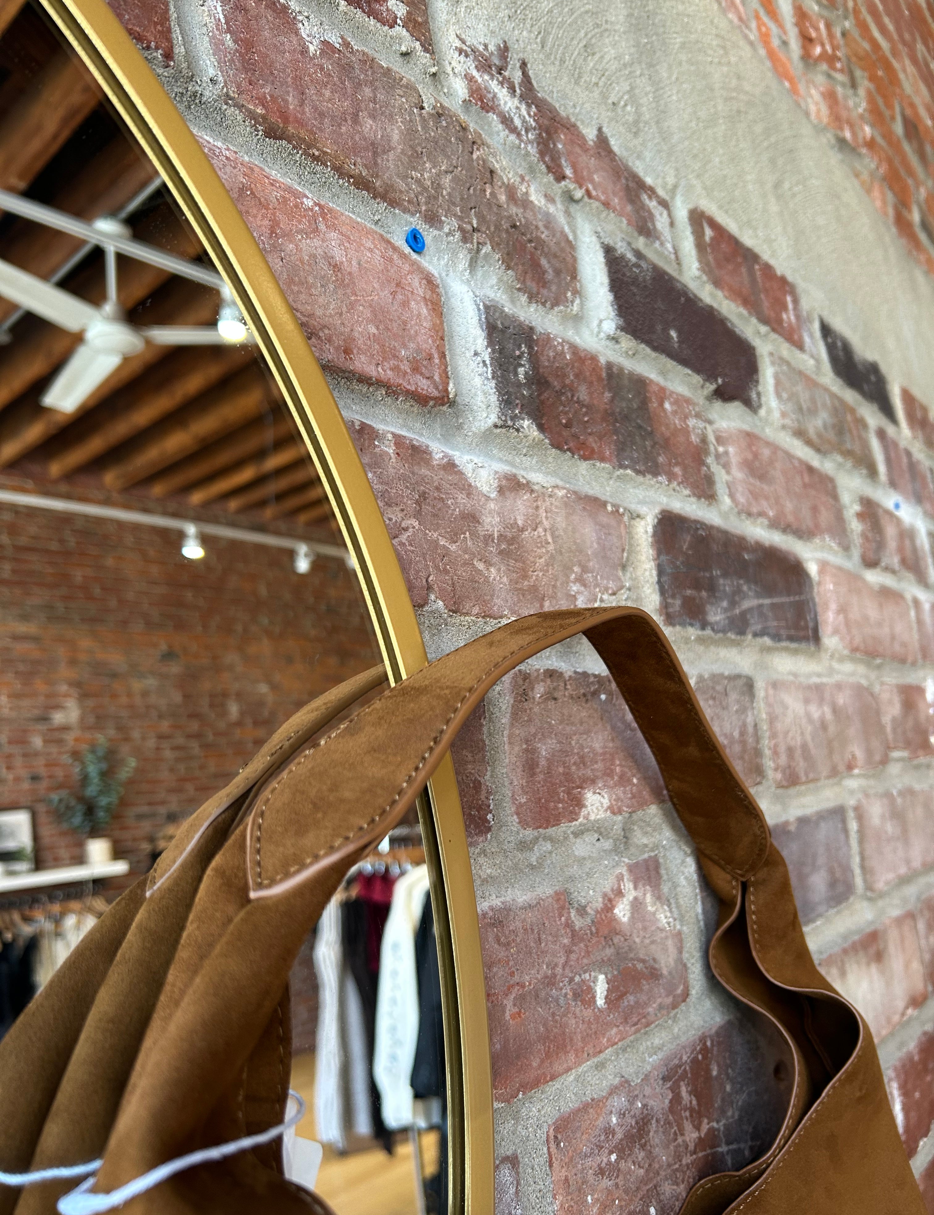 Camel suede shoulder bag with magnetic closure. 