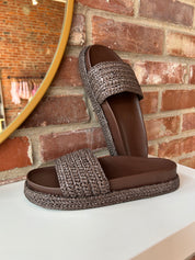 Billini Annie Brown Woven Sandal with a braided strap, cushioned sole, and slip-on design for a chic and comfortable look.