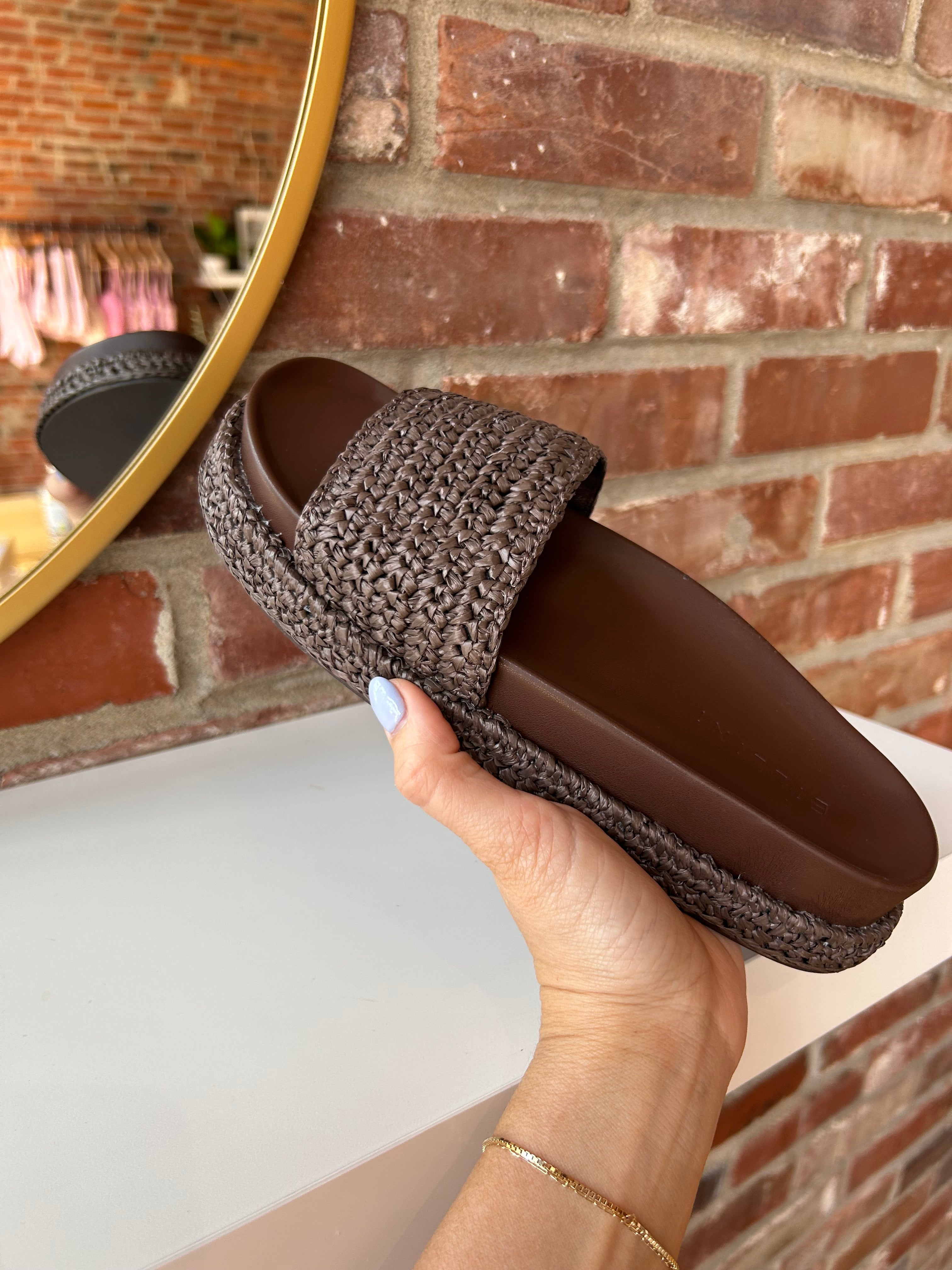 Billini Annie Brown Woven Sandal with a braided strap, cushioned sole, and slip-on design for a chic and comfortable look.
