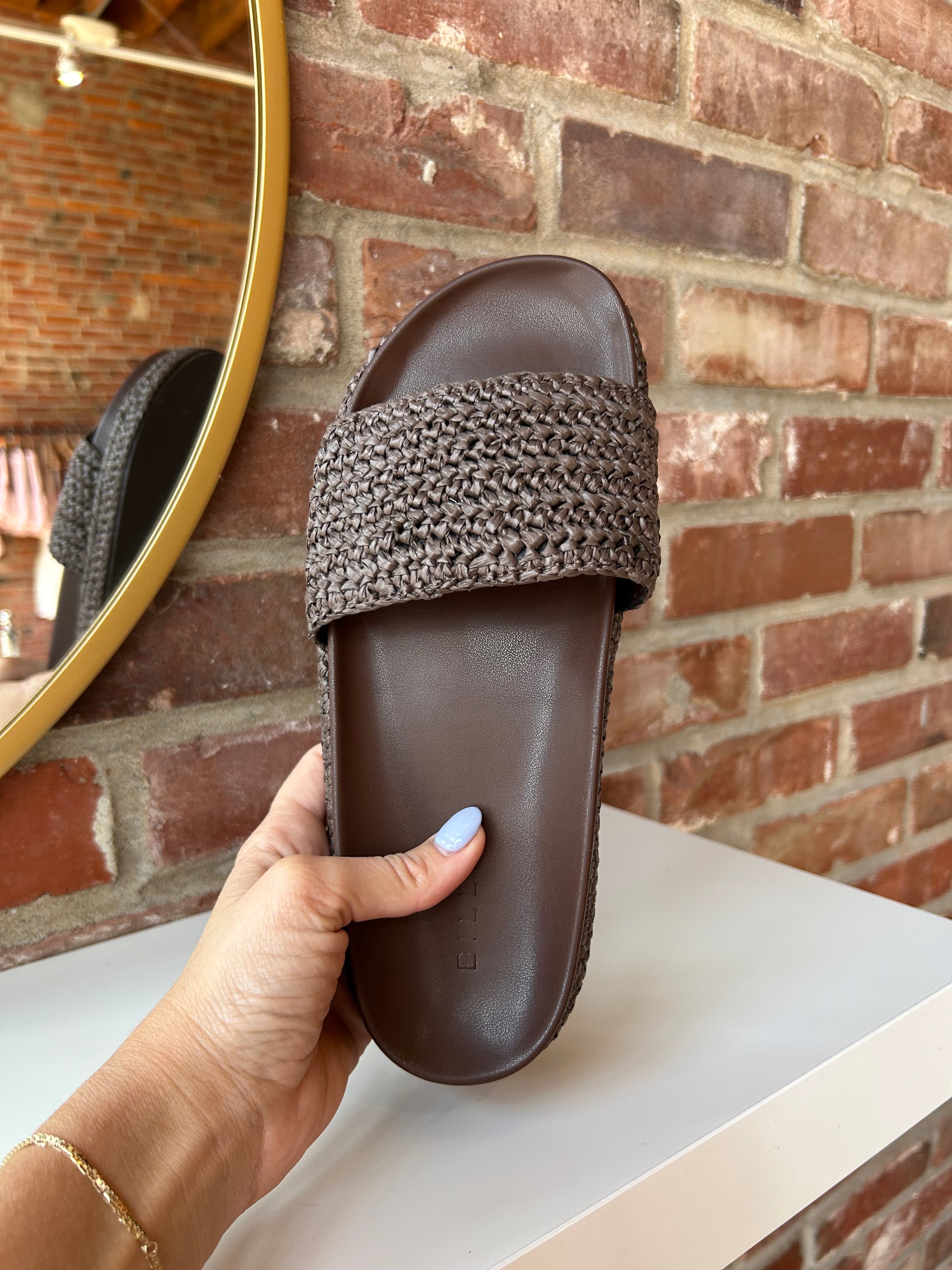 Billini Annie Brown Woven Sandal with a braided strap, cushioned sole, and slip-on design for a chic and comfortable look.
