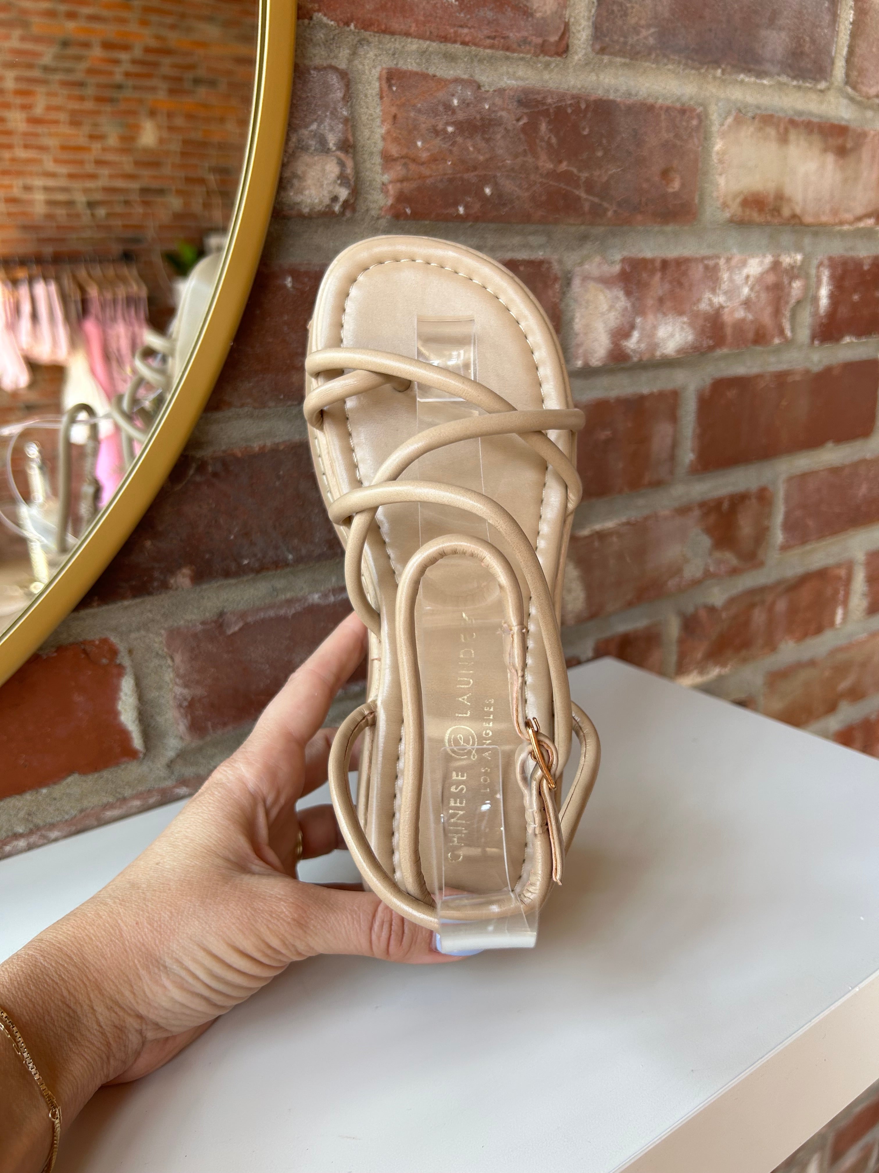 Taylor Strappy Platform Sandals with crisscross straps, an ankle buckle, and a cushioned platform sole for a trendy, comfortable fit