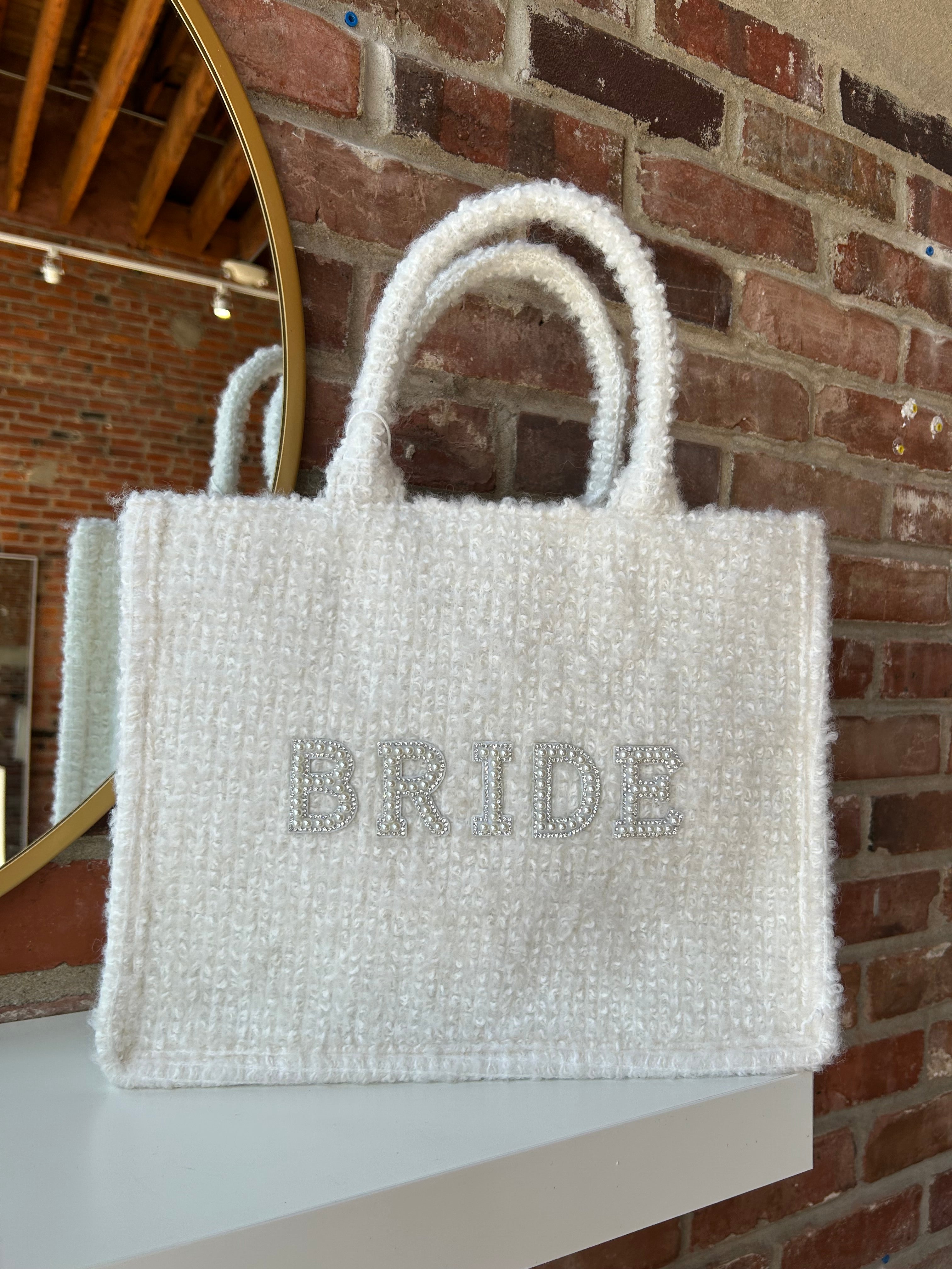 Bride Tweed Tote Bag with pearl-embellished lettering, soft textured fabric, and durable handles for a stylish bridal look.
