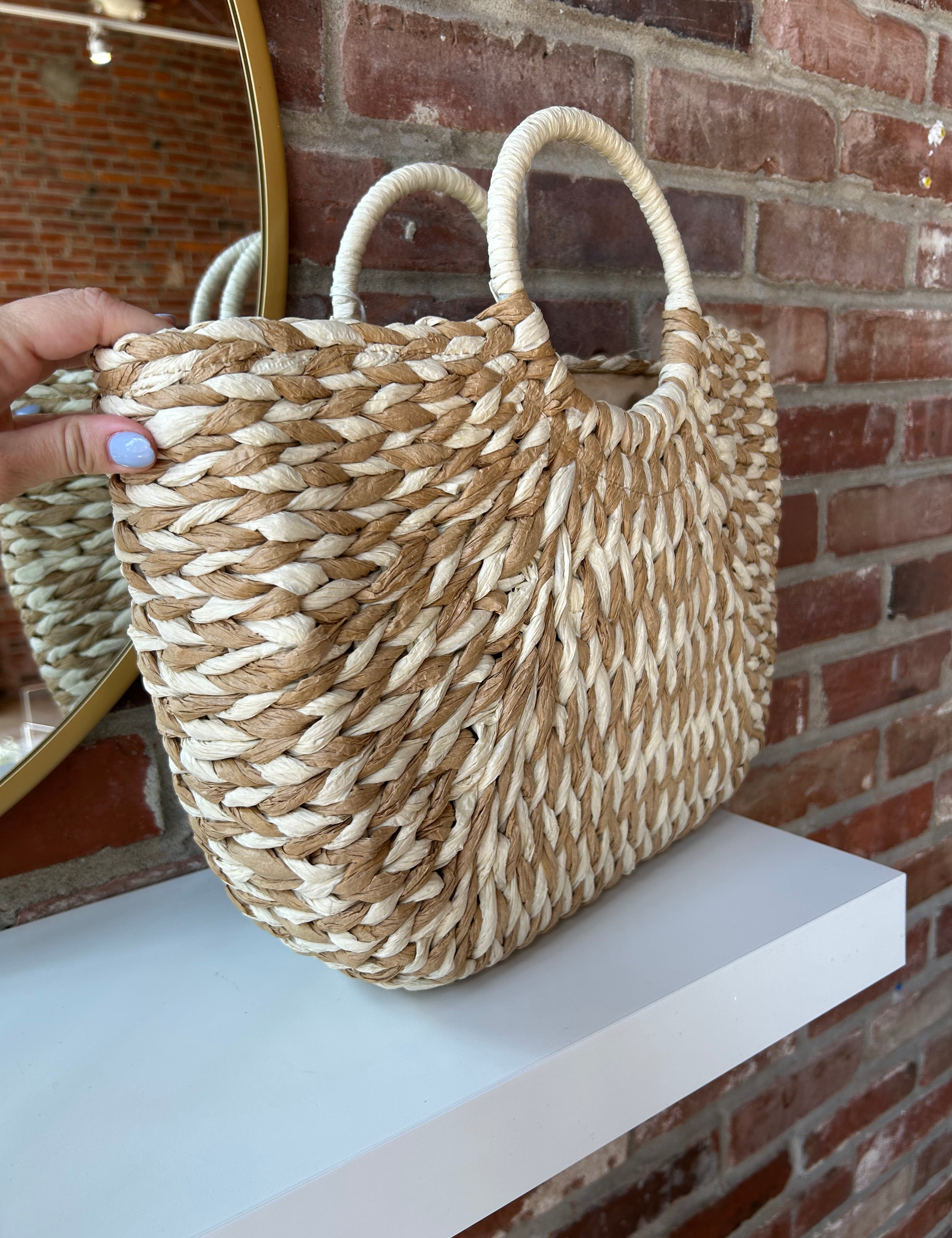 Tan and beige straw your bag. Perfect for carrying all summer long. 