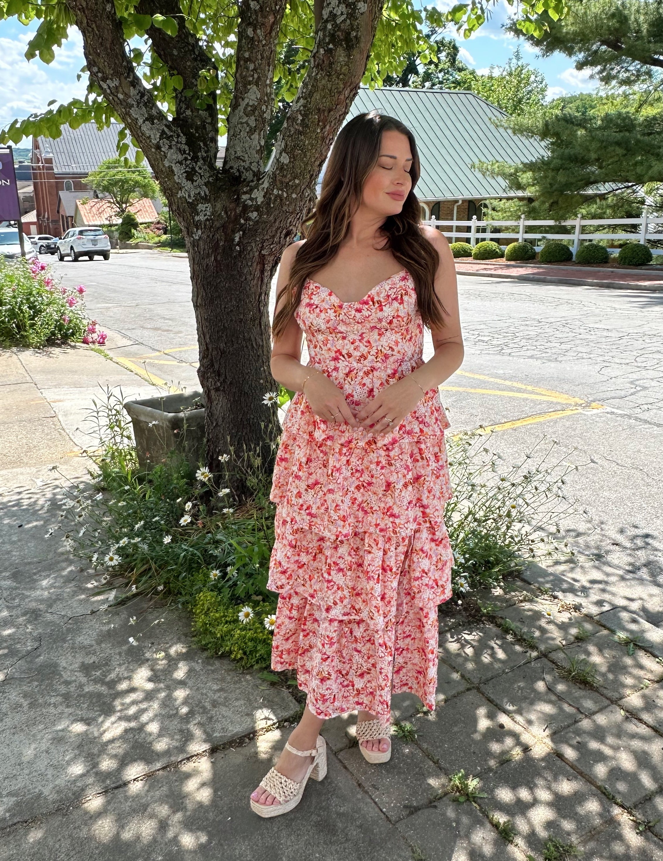 Pink floral textured tiered maxi dress with adjustable straps.