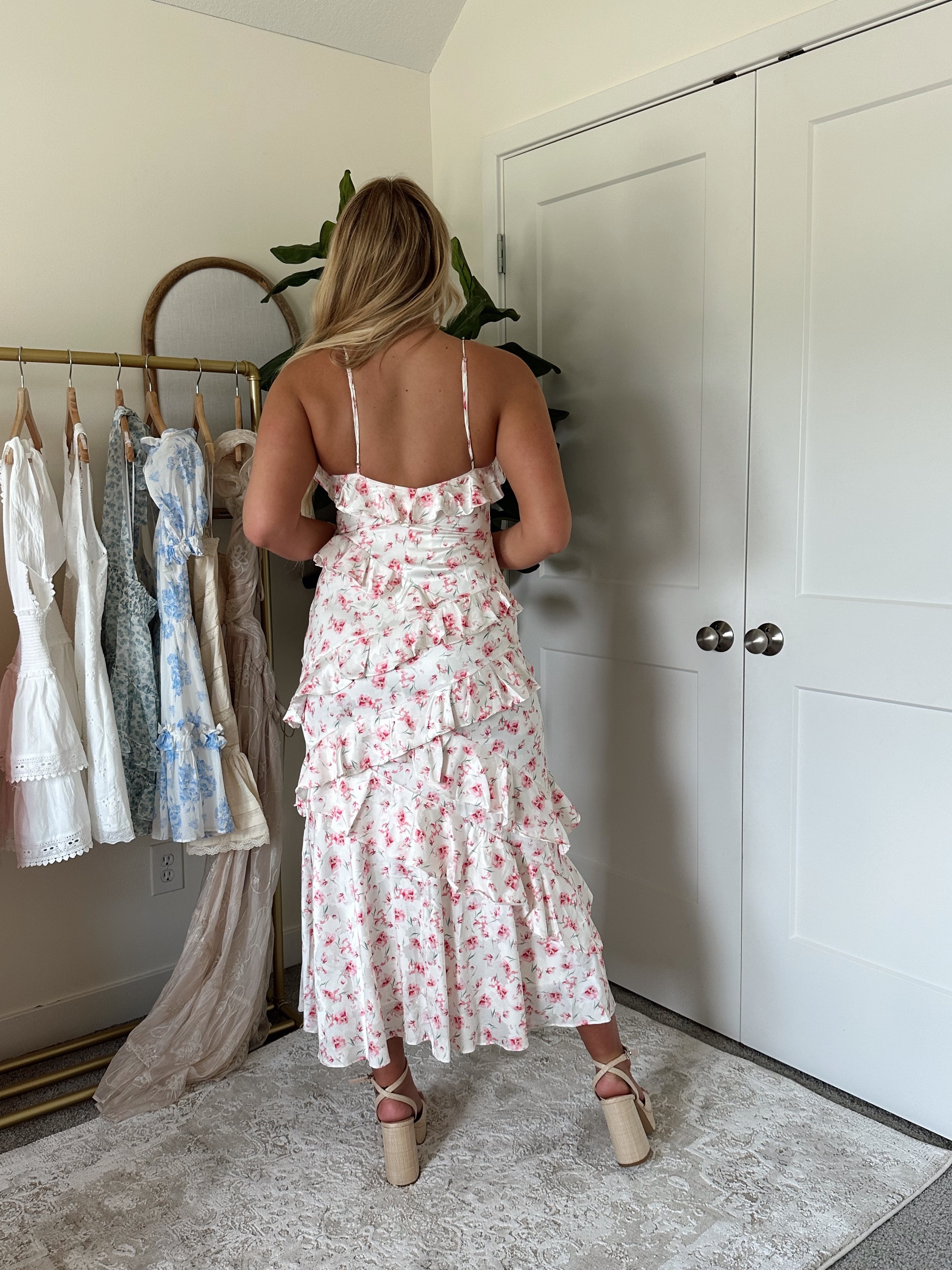Pink floral ruffled midi dress with spaghetti straps and tiered hem