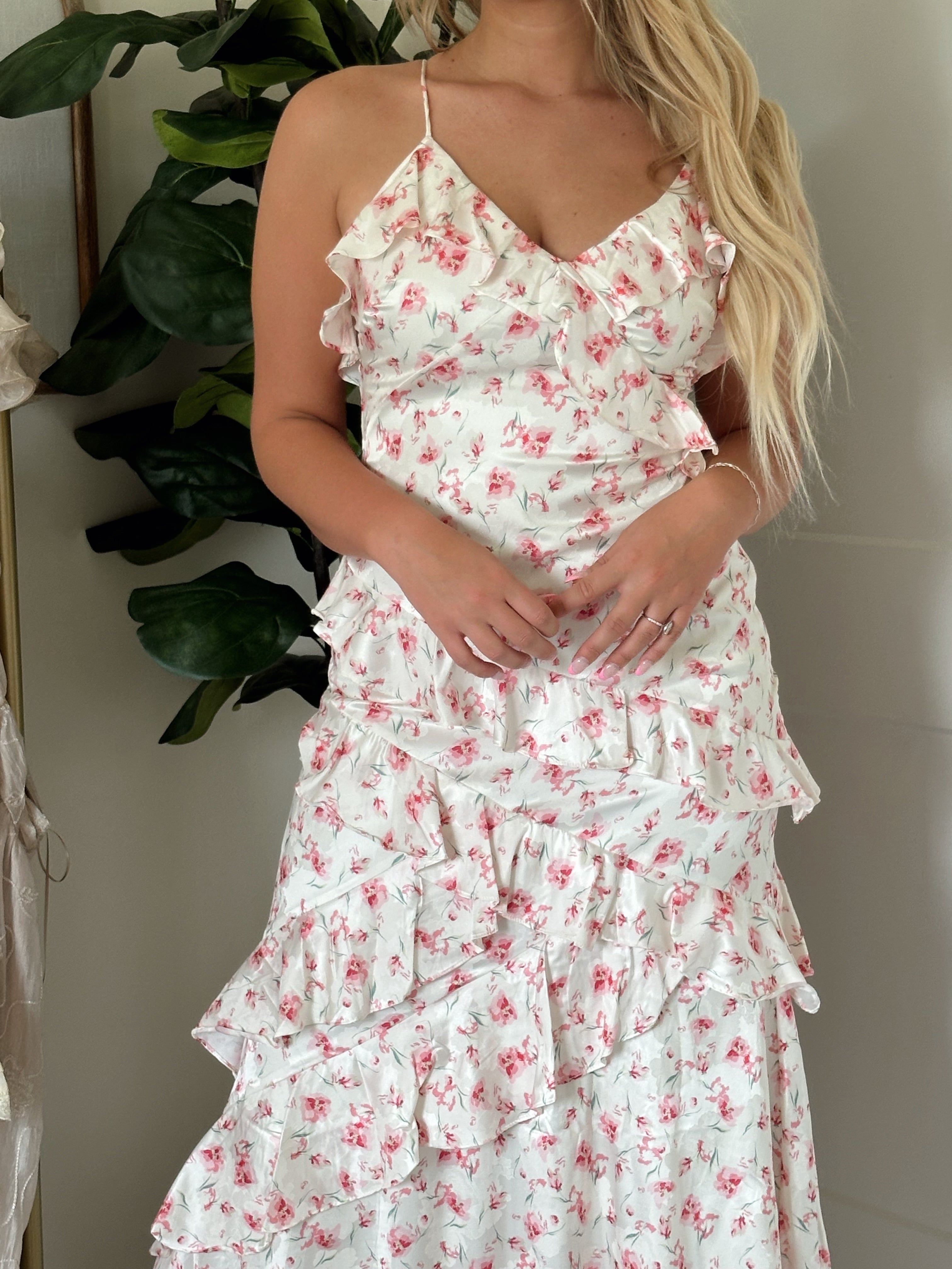 Pink floral ruffled midi dress with spaghetti straps and tiered hem