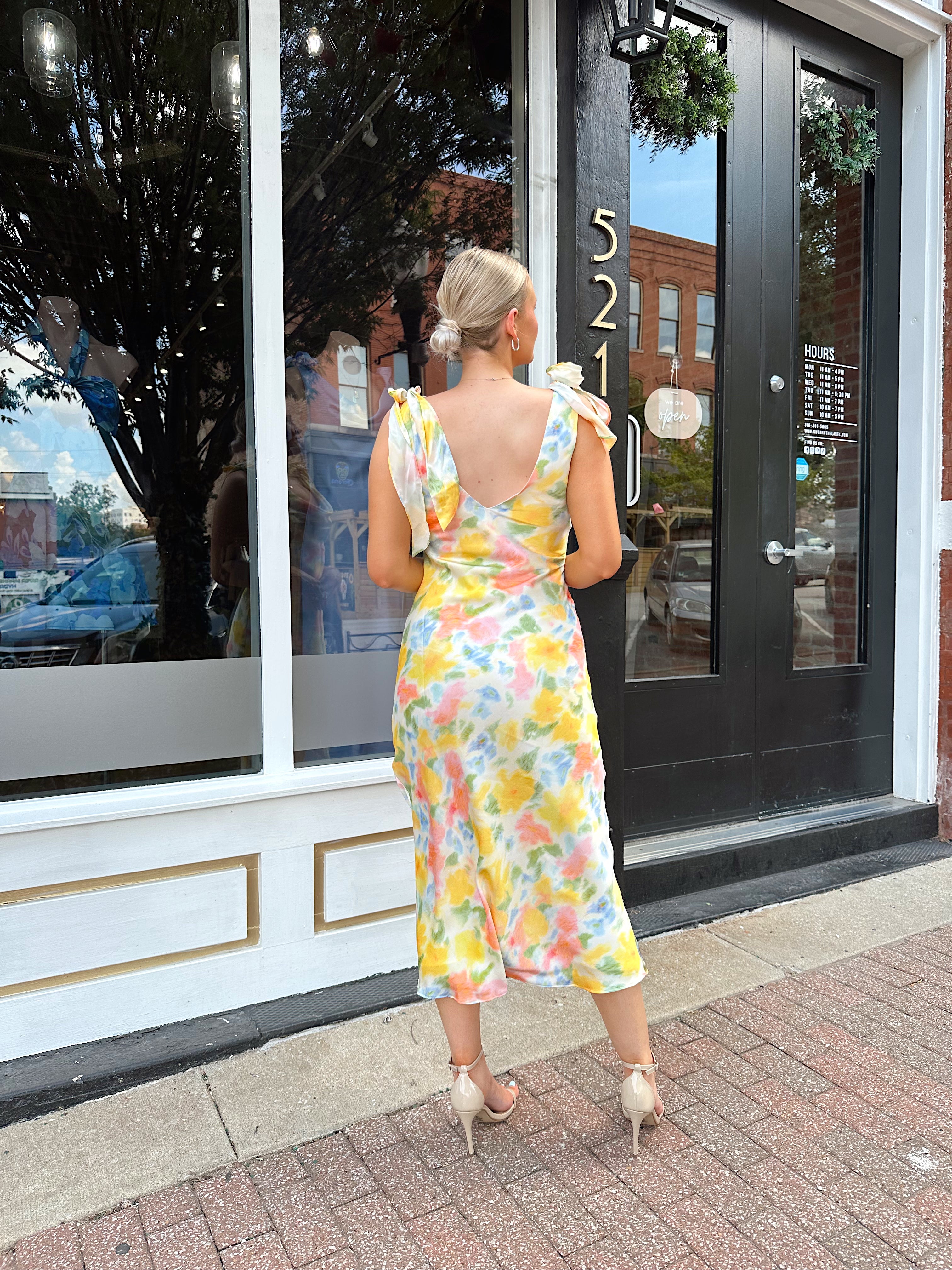 Yellow multicolor floral satin midi dress with self tie straps and cowl neck.