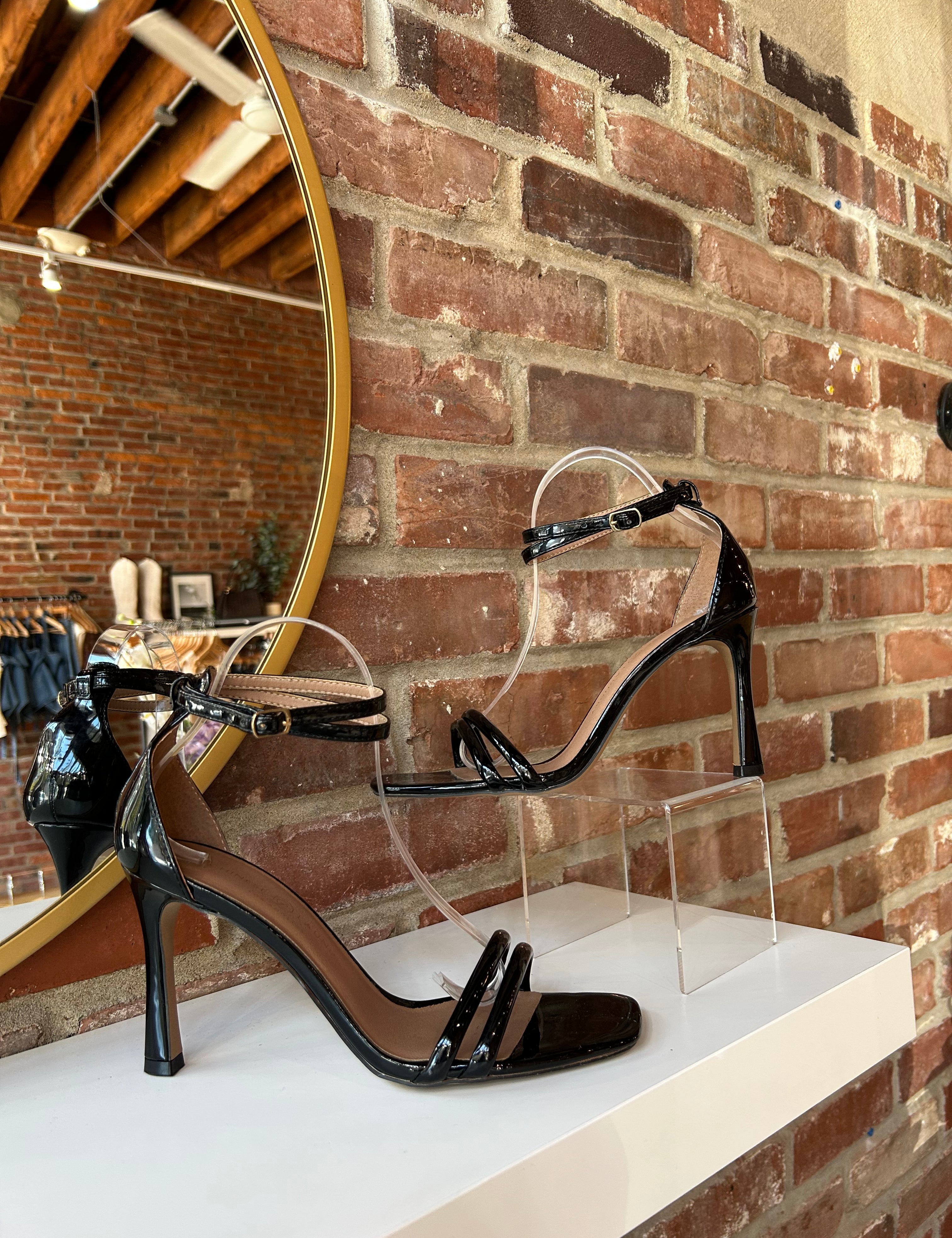 Black patent open toe heel with double front straps and ankle buckle closure