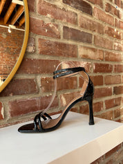 Black patent open toe heel with double front straps and ankle buckle closure