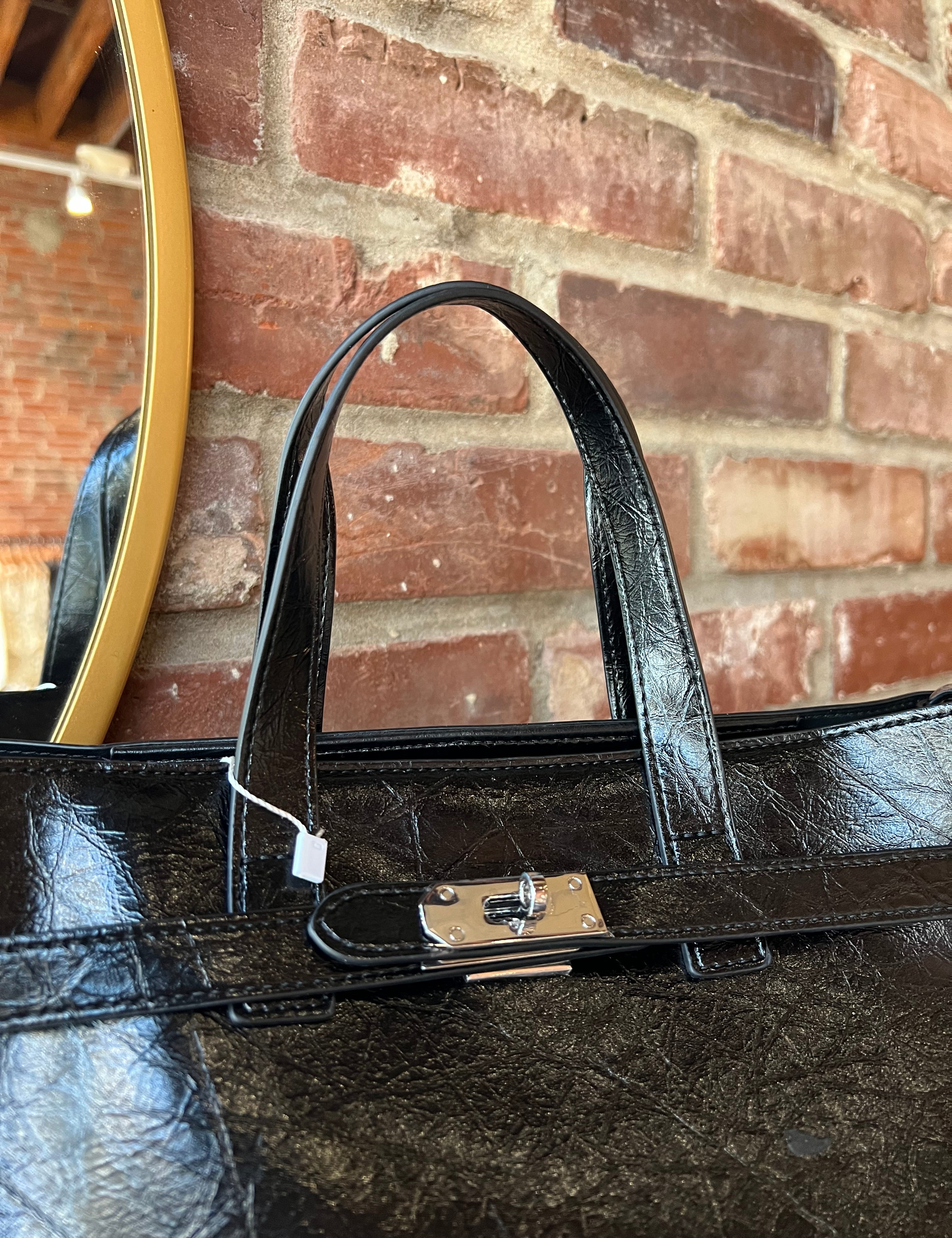 Jetta Black Leather Tote Bag with structured shape, top handles, and matching removable inner pouch