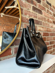 Jetta Black Leather Tote Bag with structured shape, top handles, and matching removable inner pouch