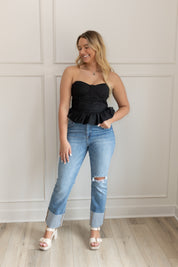 Black strapless corset top with peplum hem and fitted bodice