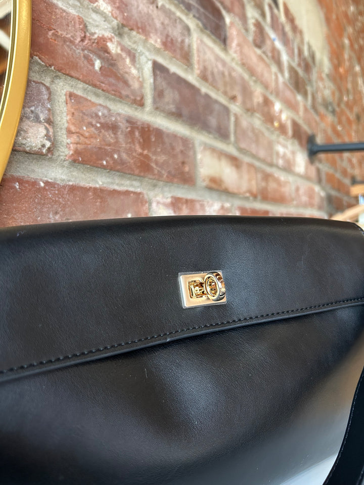 Black leather shoulder bag with metal hardware and removable shoulder strap.