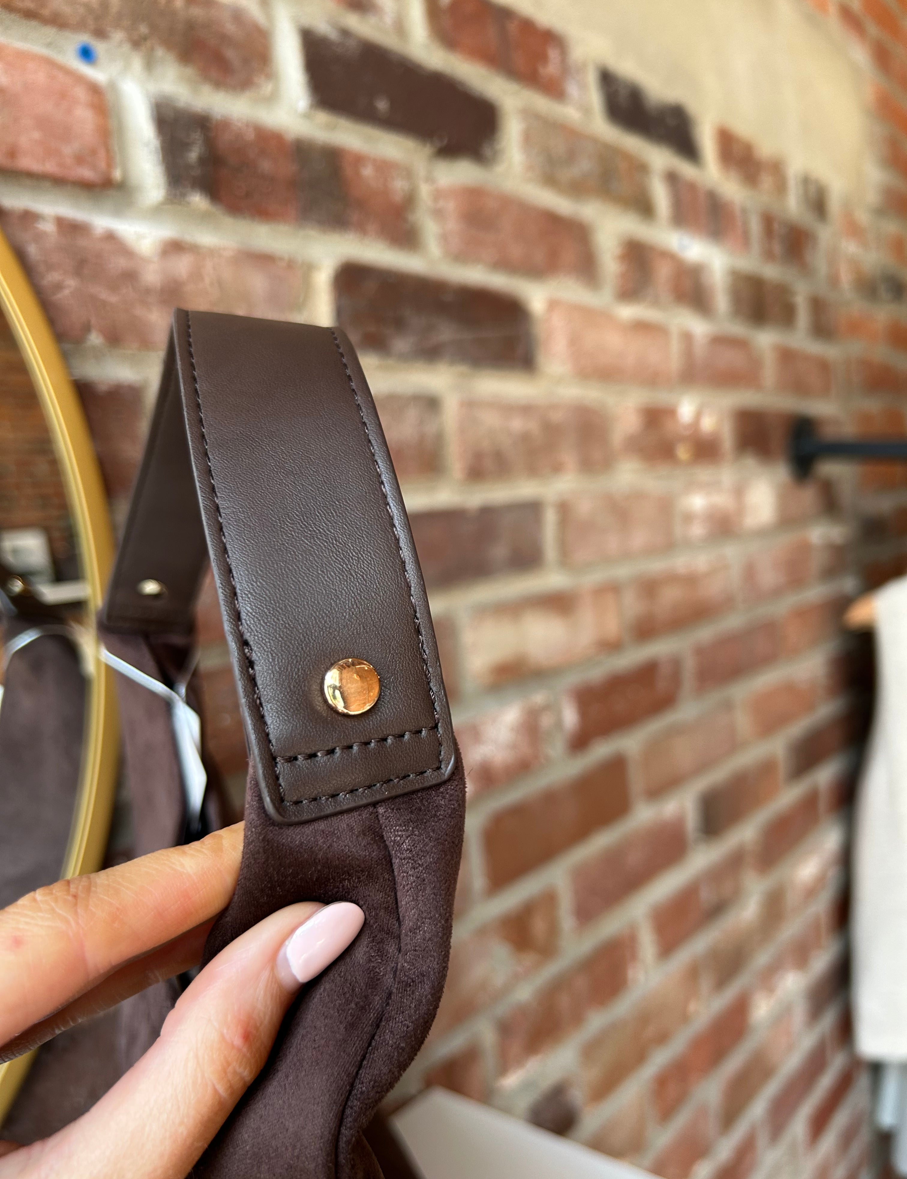 Brown suede shoulder bag with structured handle and roomy minimalist silhouette
