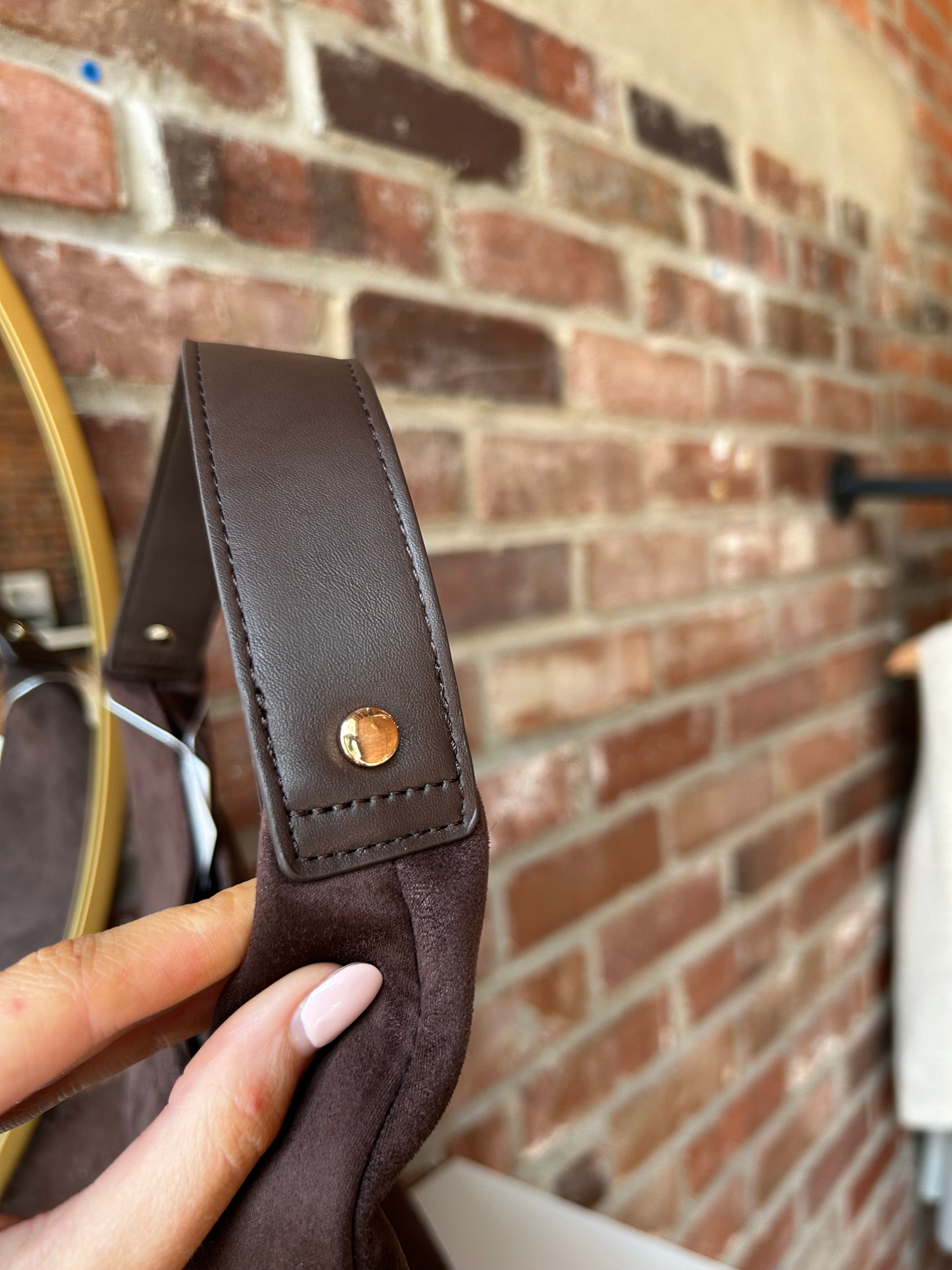 Brown suede shoulder bag with structured handle and roomy minimalist silhouette