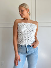 White smocked polka dot tube top with tiered elastic.