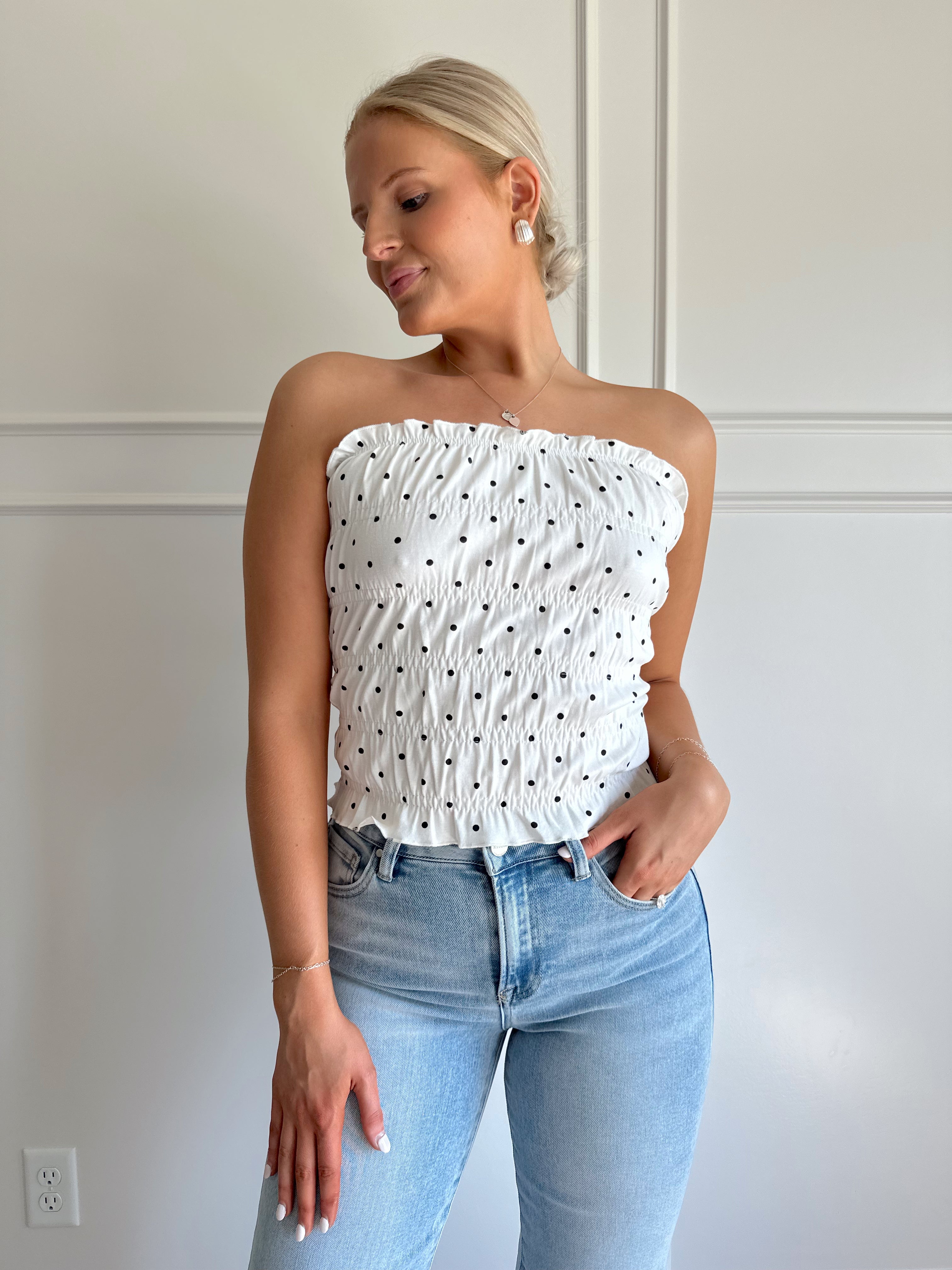 White smocked polka dot tube top with tiered elastic.