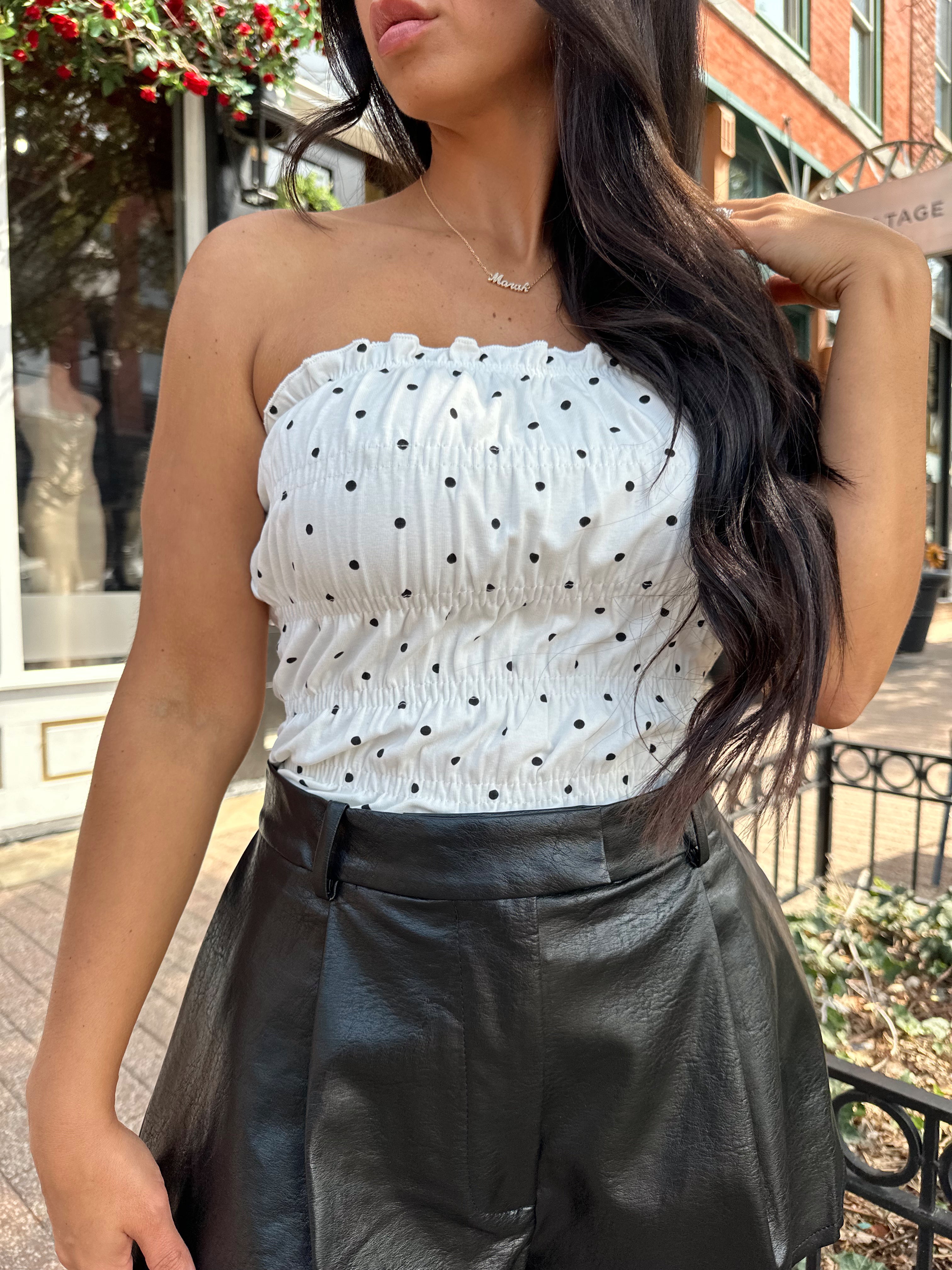 White smocked polka dot tube top with tiered elastic.