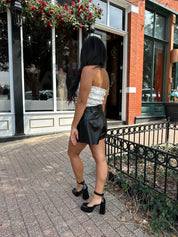 White smocked polka dot tube top with tiered elastic.