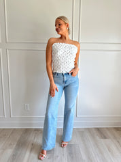 White smocked polka dot tube top with tiered elastic.