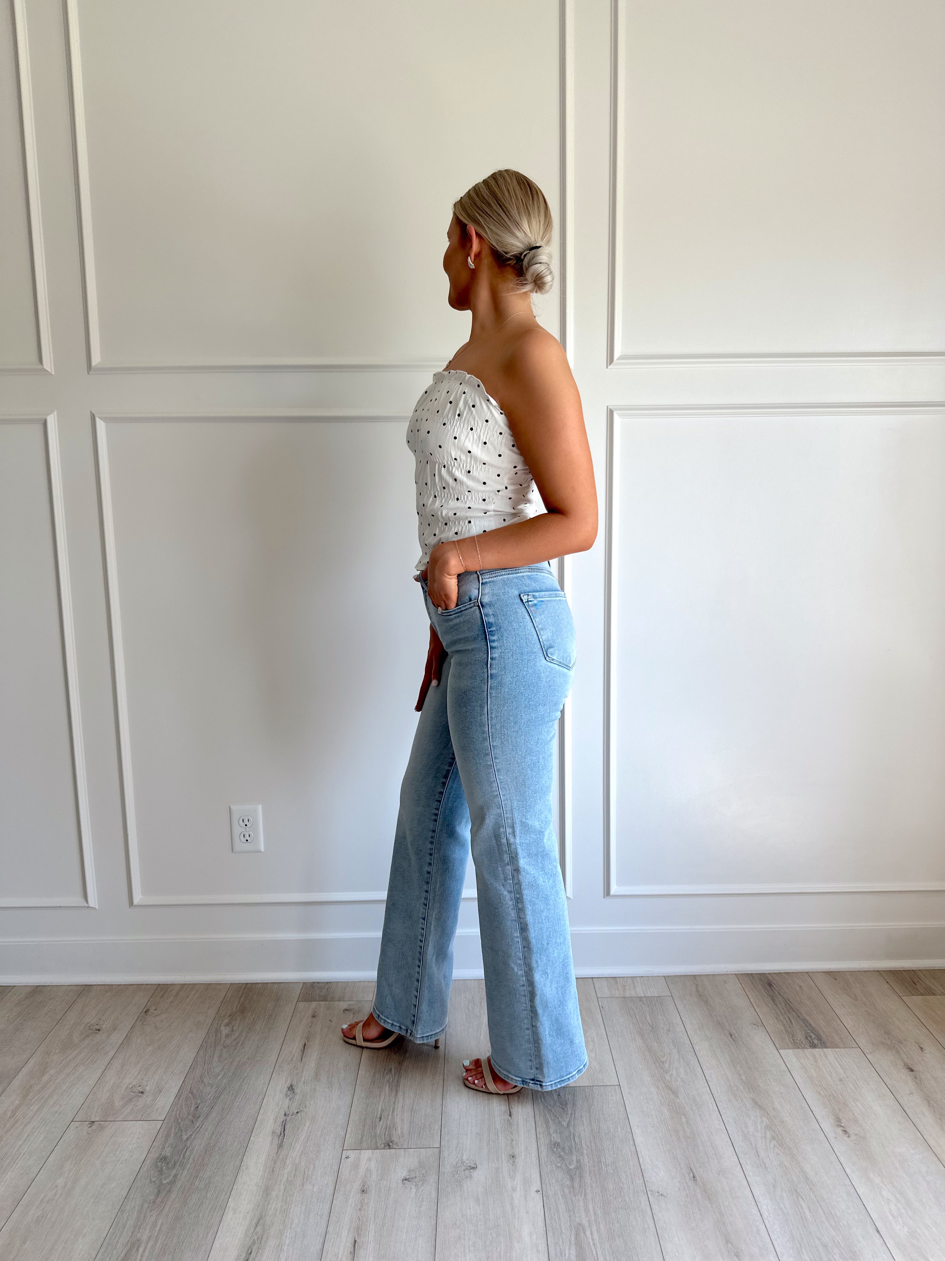 White smocked polka dot tube top with tiered elastic.